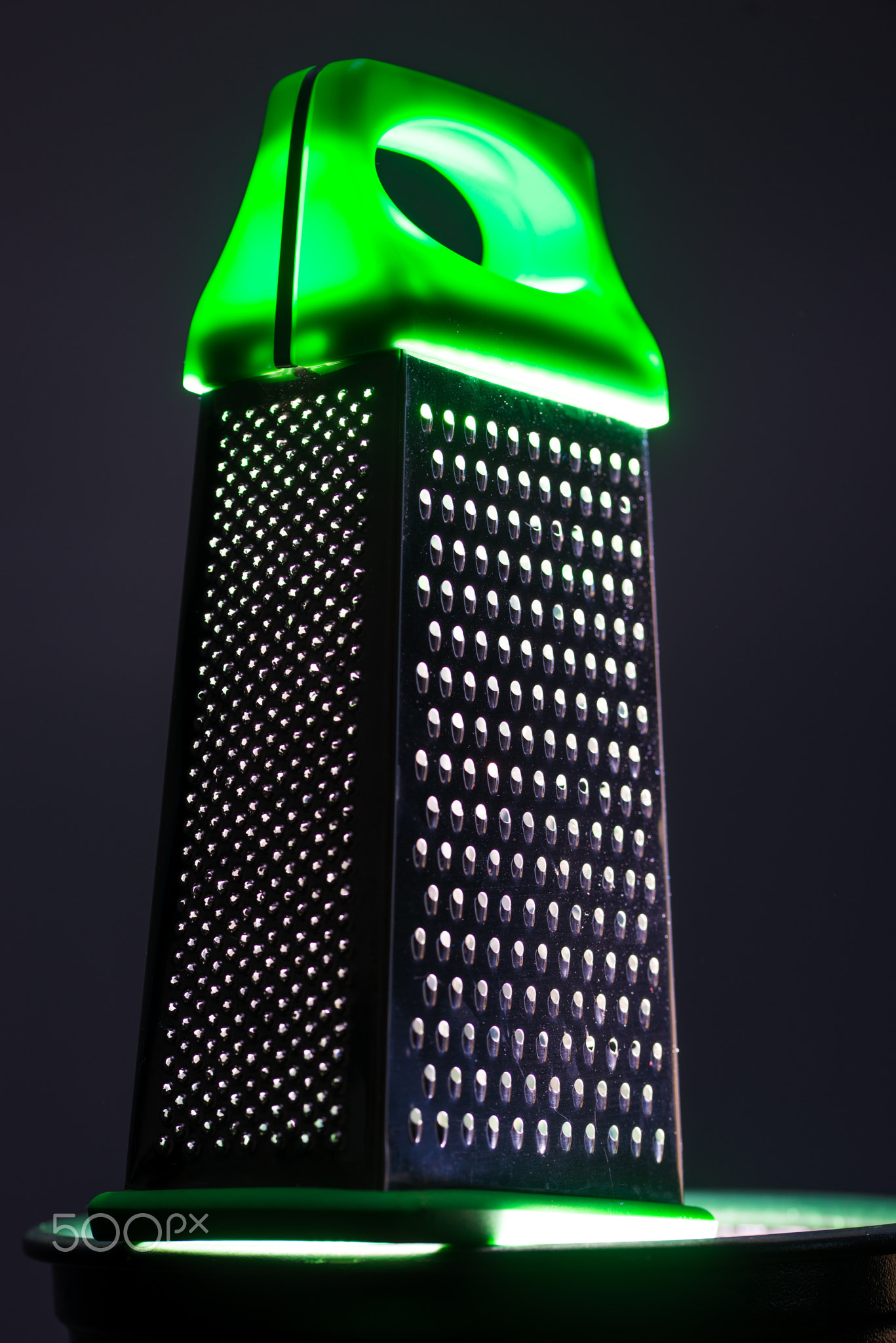 Food grater with green handle