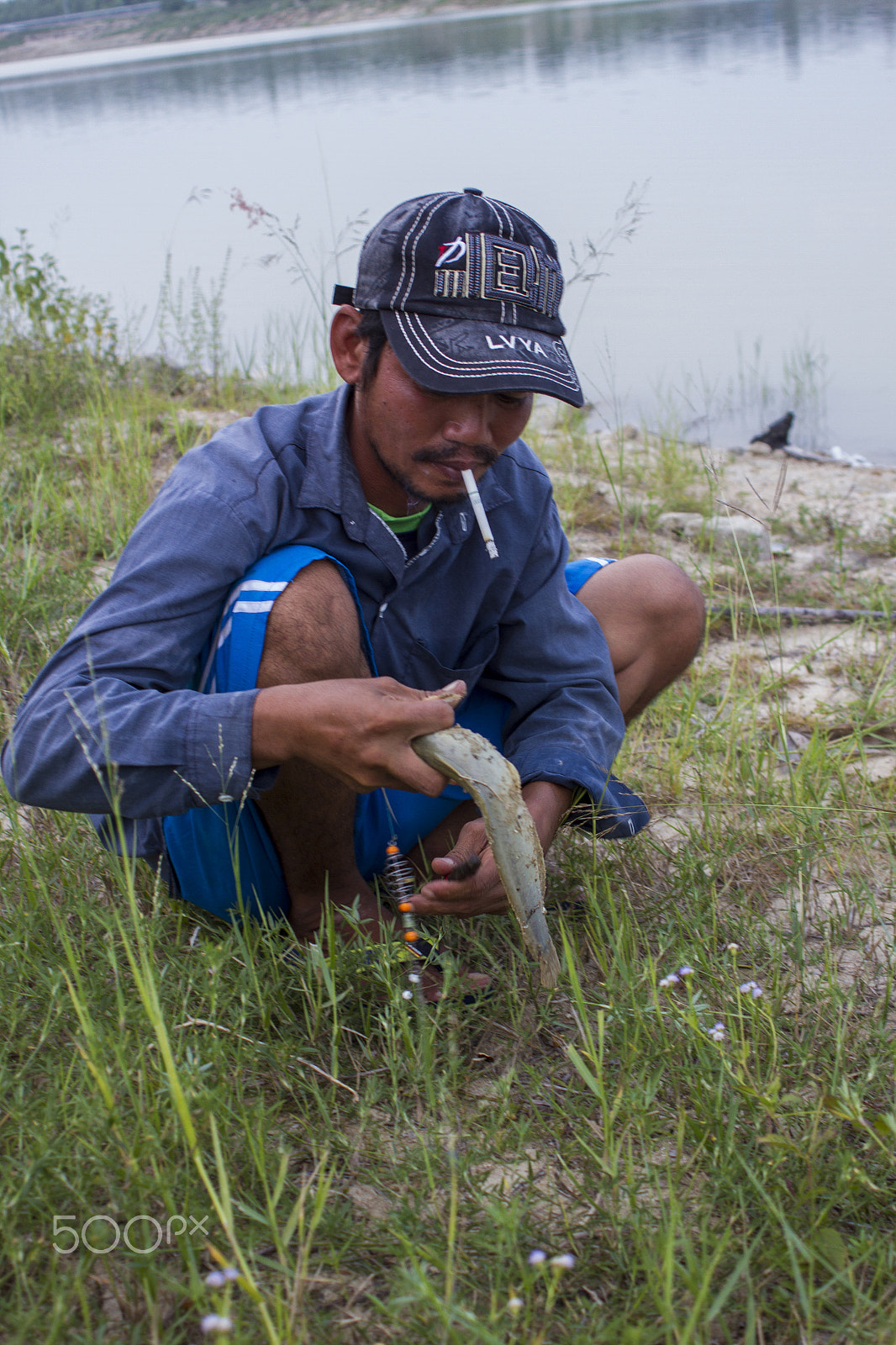 Canon EOS 7D + Canon EF 28-80mm f/3.5-5.6 USM IV sample photo. Fishing man photography