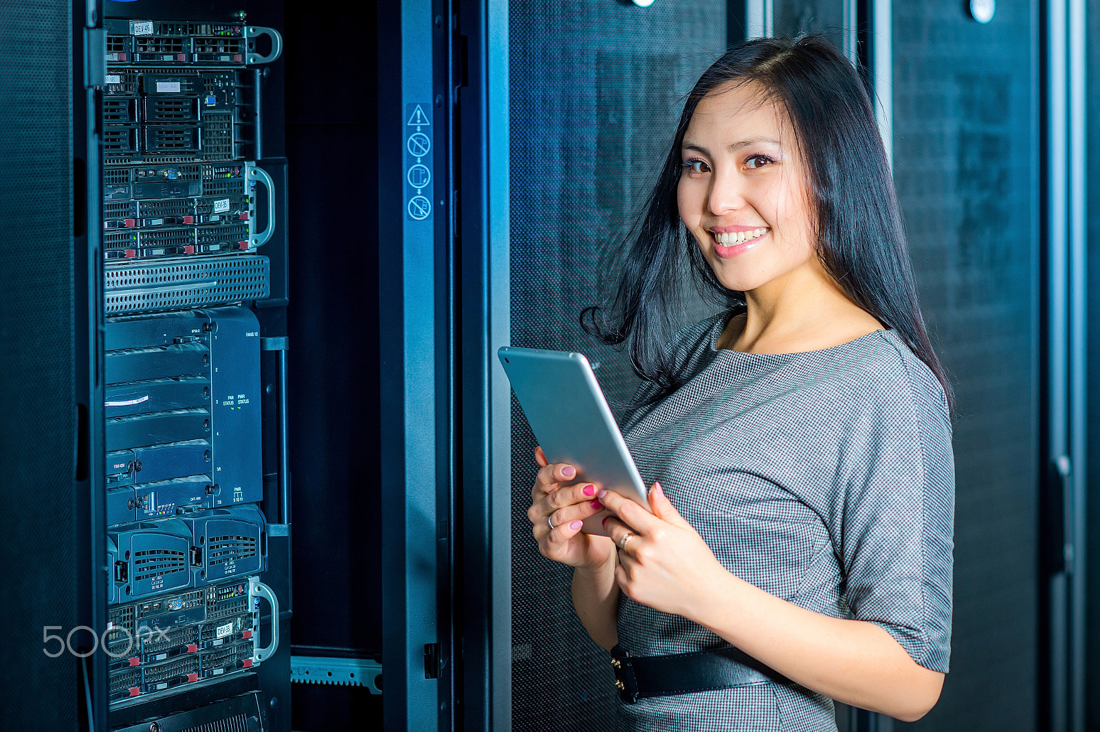 Nikon D600 + AF DC-Nikkor 135mm f/2 sample photo. Engineer businesswoman in network server room photography