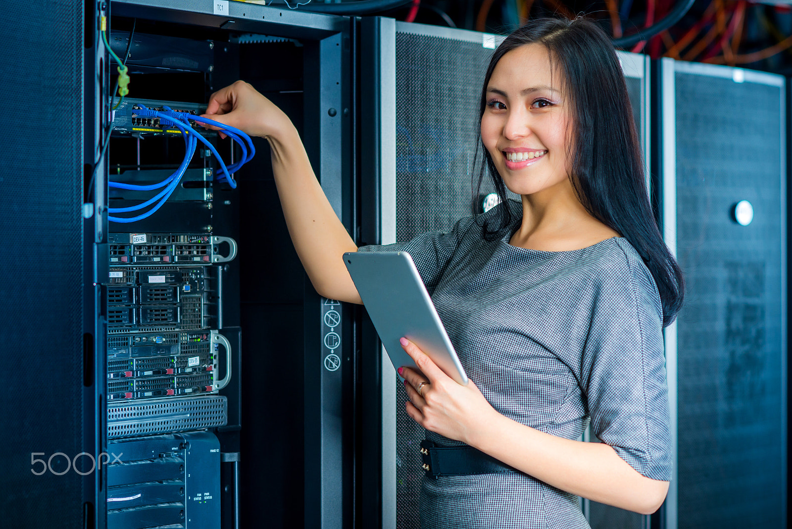 Nikon D600 + AF DC-Nikkor 135mm f/2 sample photo. Engineer businesswoman in network server room photography