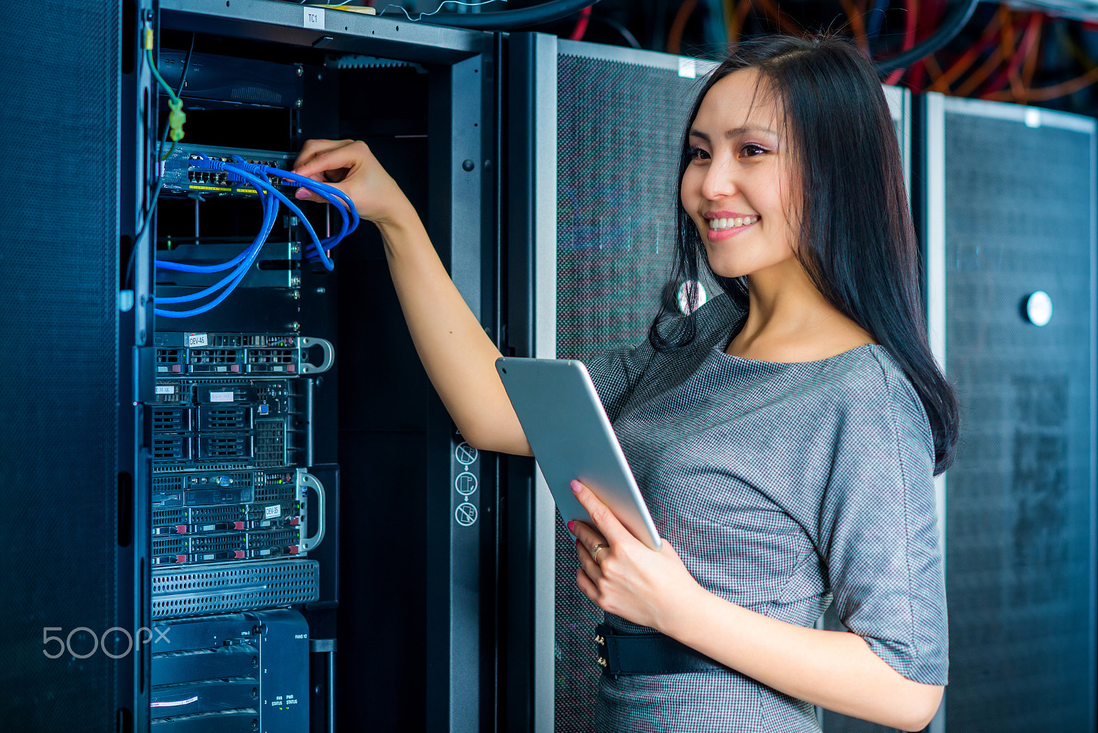 Nikon D600 + AF DC-Nikkor 135mm f/2 sample photo. Engineer businesswoman in network server room photography