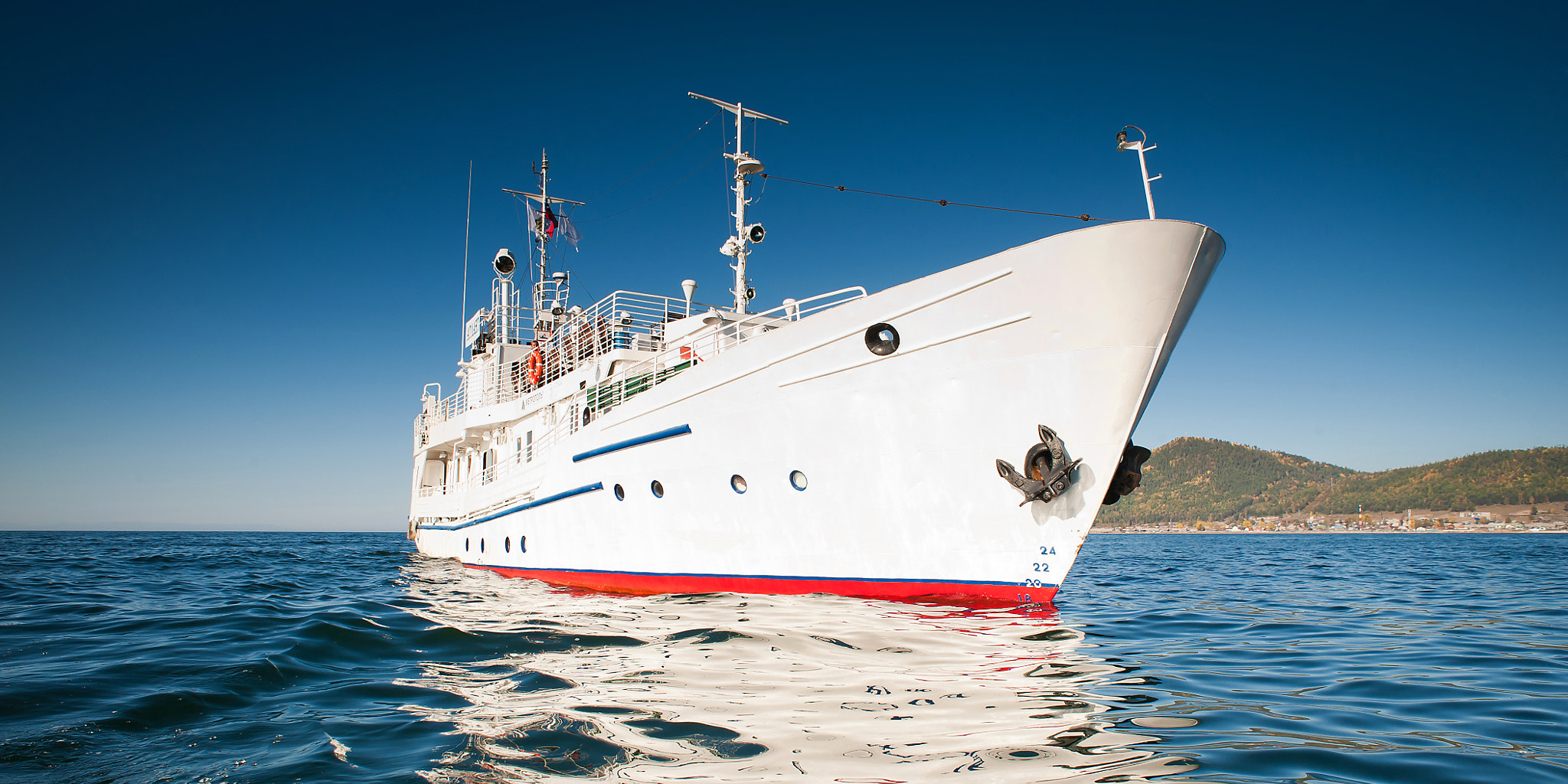 AF Nikkor 20mm f/2.8 sample photo. White ship in the water of lake baikal photography