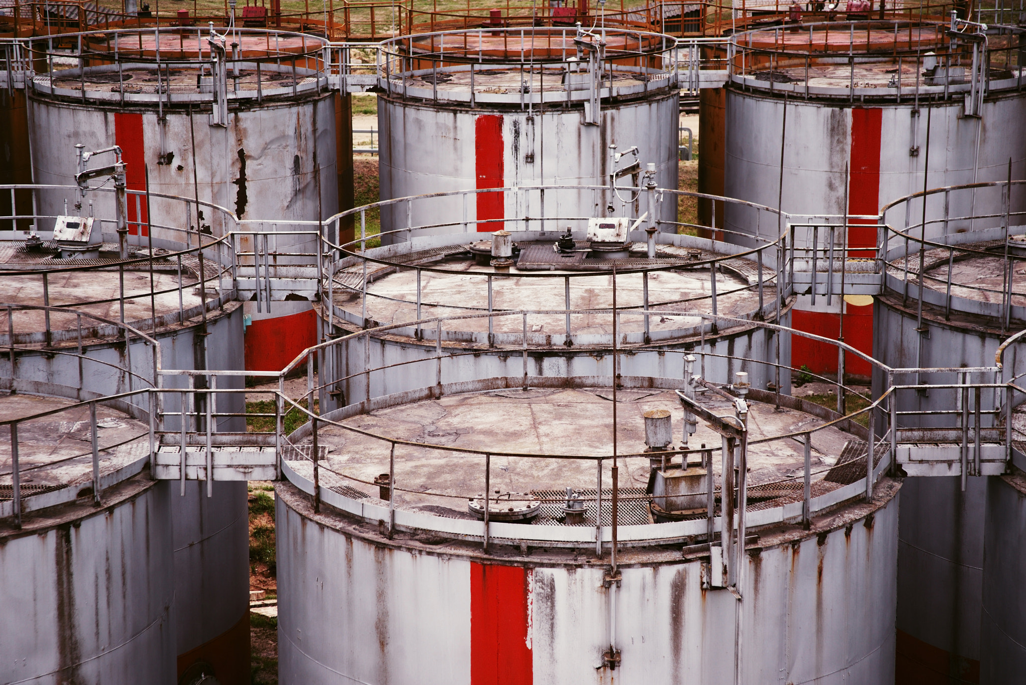 28.0 - 135.0 mm sample photo. Pattern of old large oil storage tanks photography
