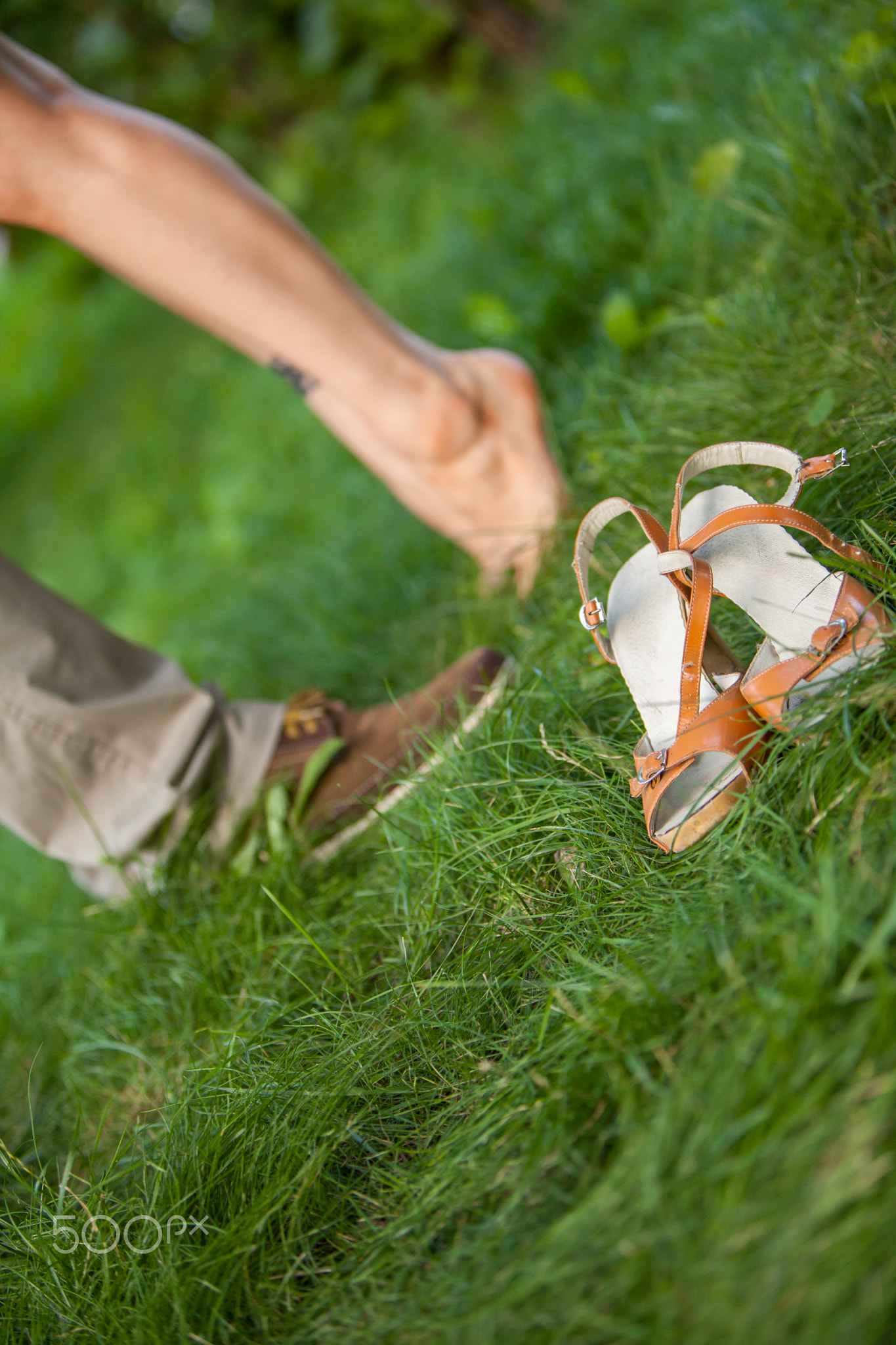 feet guys and girls on the grass