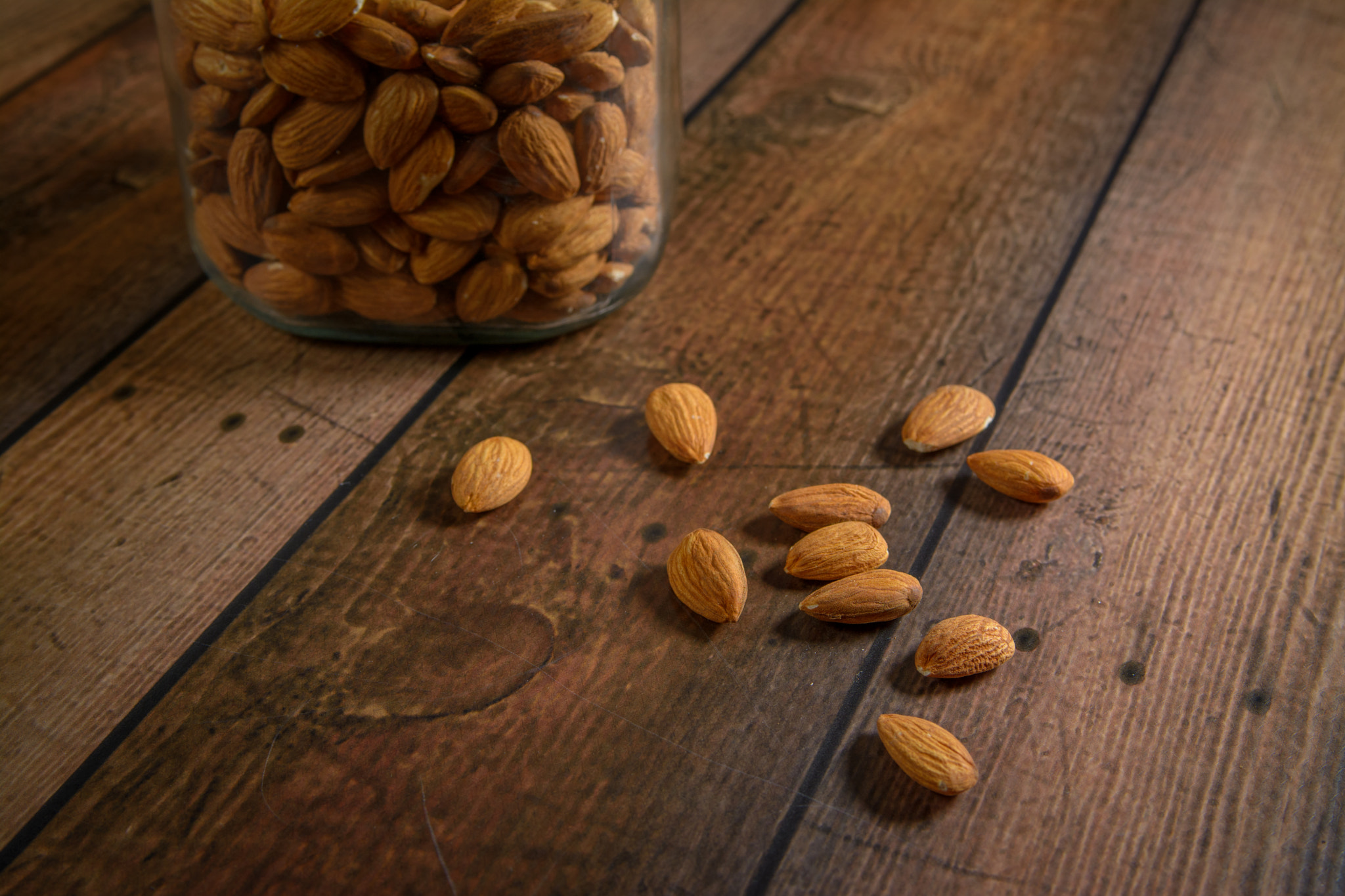 Nikon AF-S Nikkor 28-70mm F2.8 ED-IF sample photo. Almonds on wood table photography