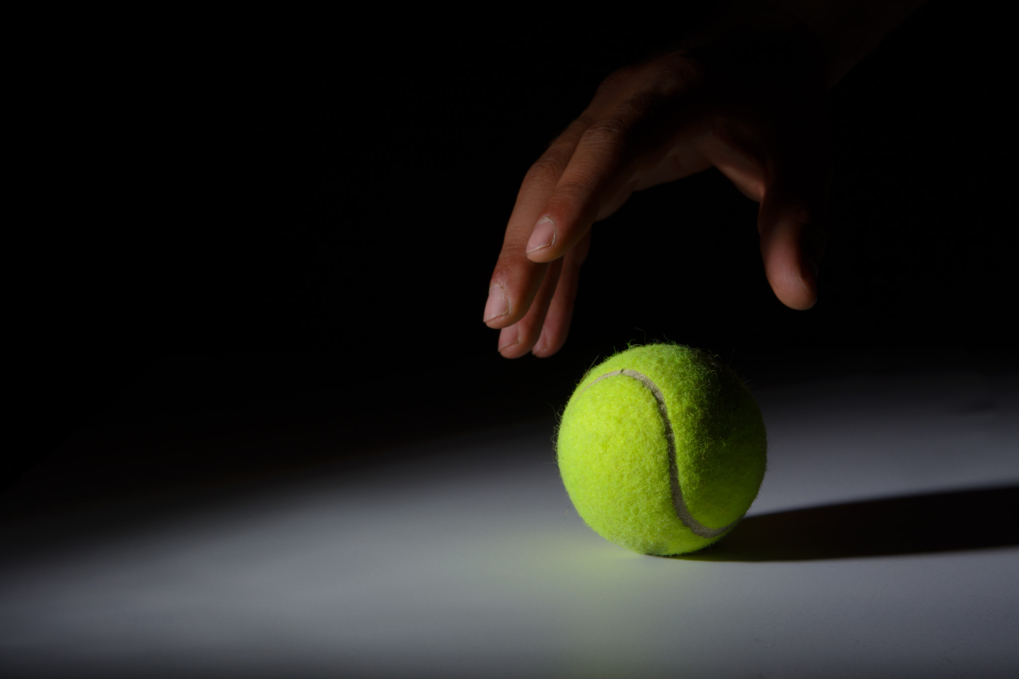 Nikon AF-S Nikkor 28-70mm F2.8 ED-IF sample photo. Hand grabbing tennis ball photography