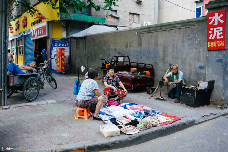 Olympus OM-D E-M10 + Panasonic Lumix G 14mm F2.5 ASPH sample photo. Street in xi'an photography