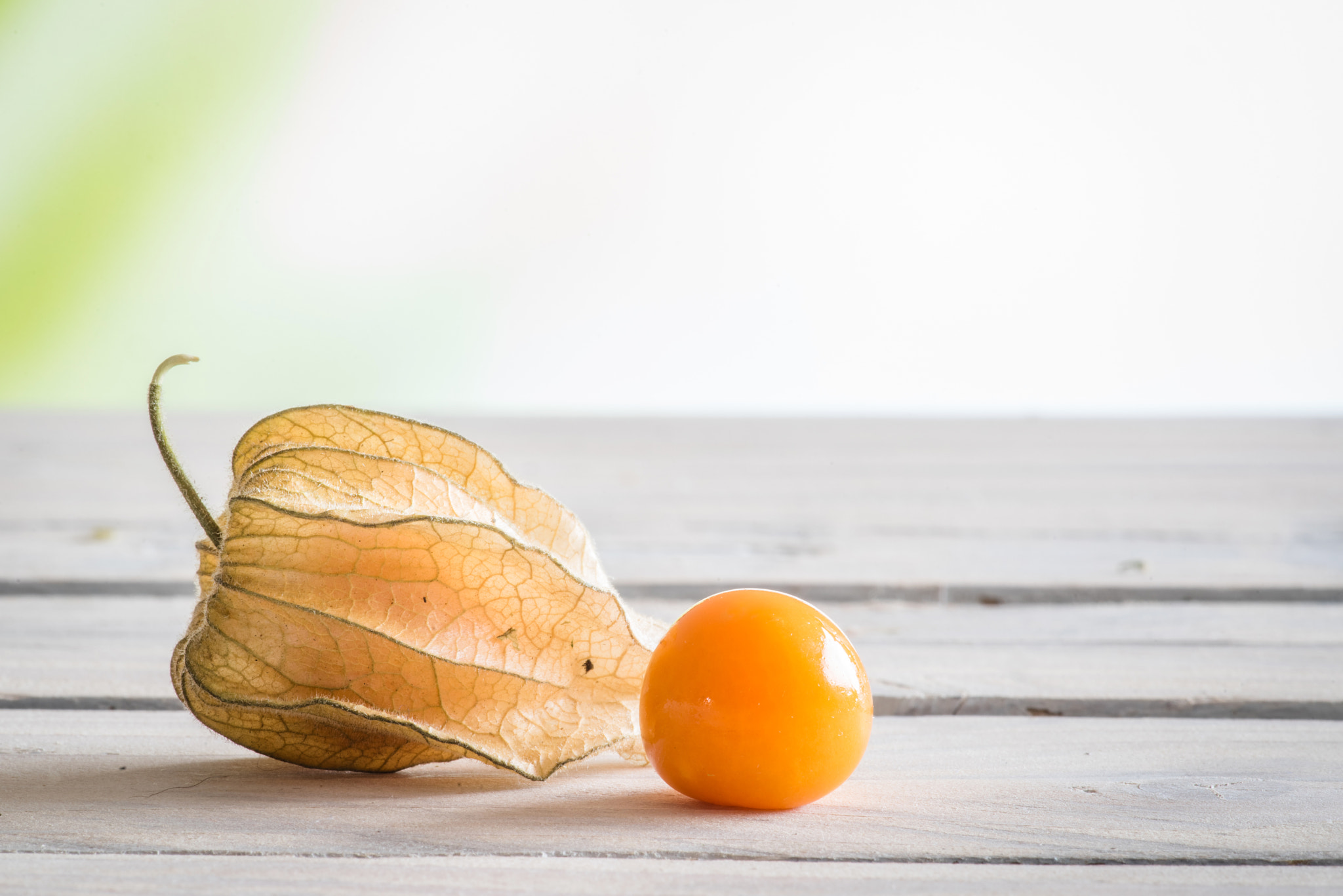 Sony a7R + Minolta AF 100mm F2.8 Macro [New] sample photo. Peruvian groundcherry on a table photography