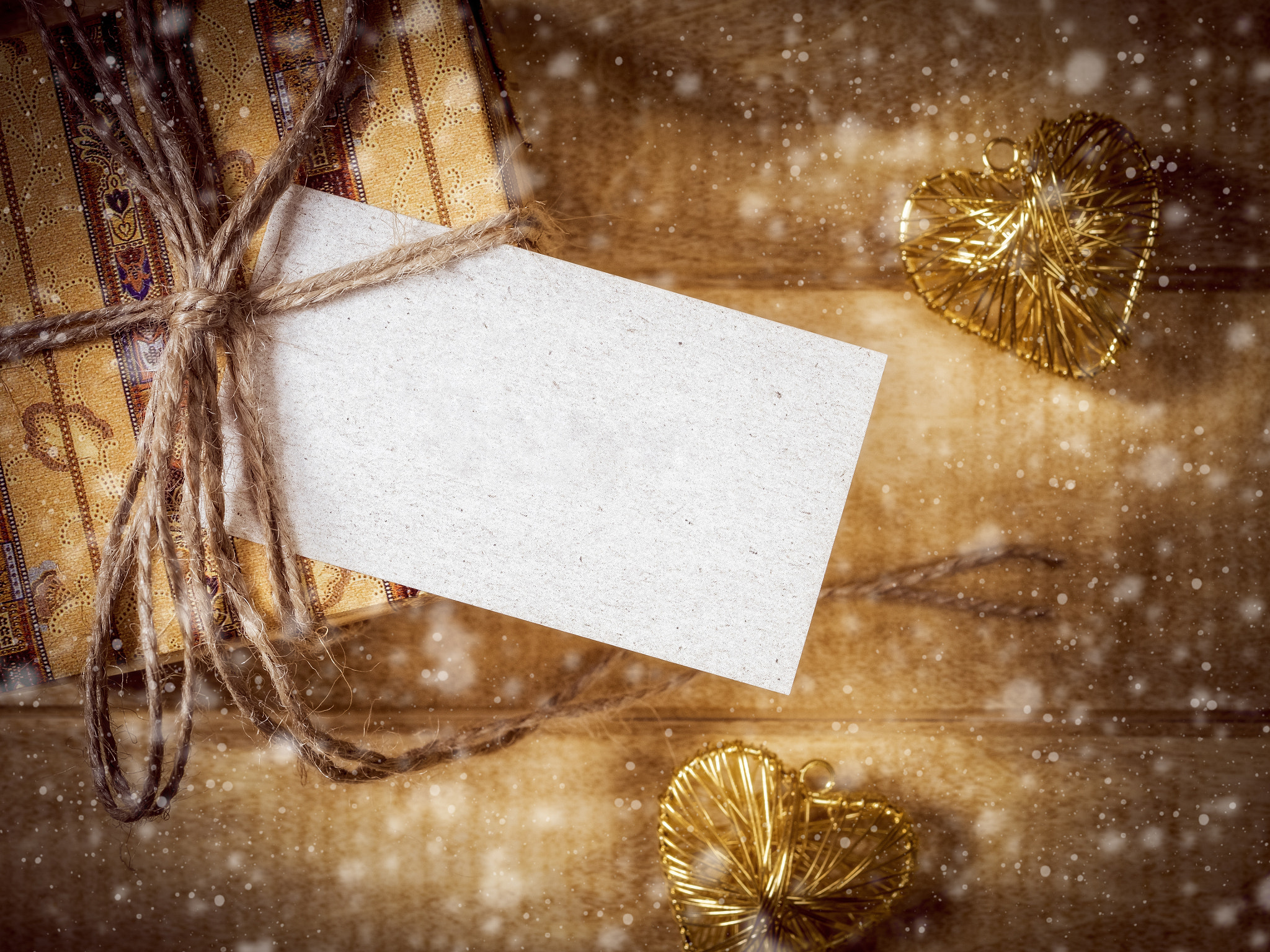 Olympus OM-D E-M1 + OLYMPUS 50mm Lens sample photo. Gift box in yellow-brown paper on the wooden table photography