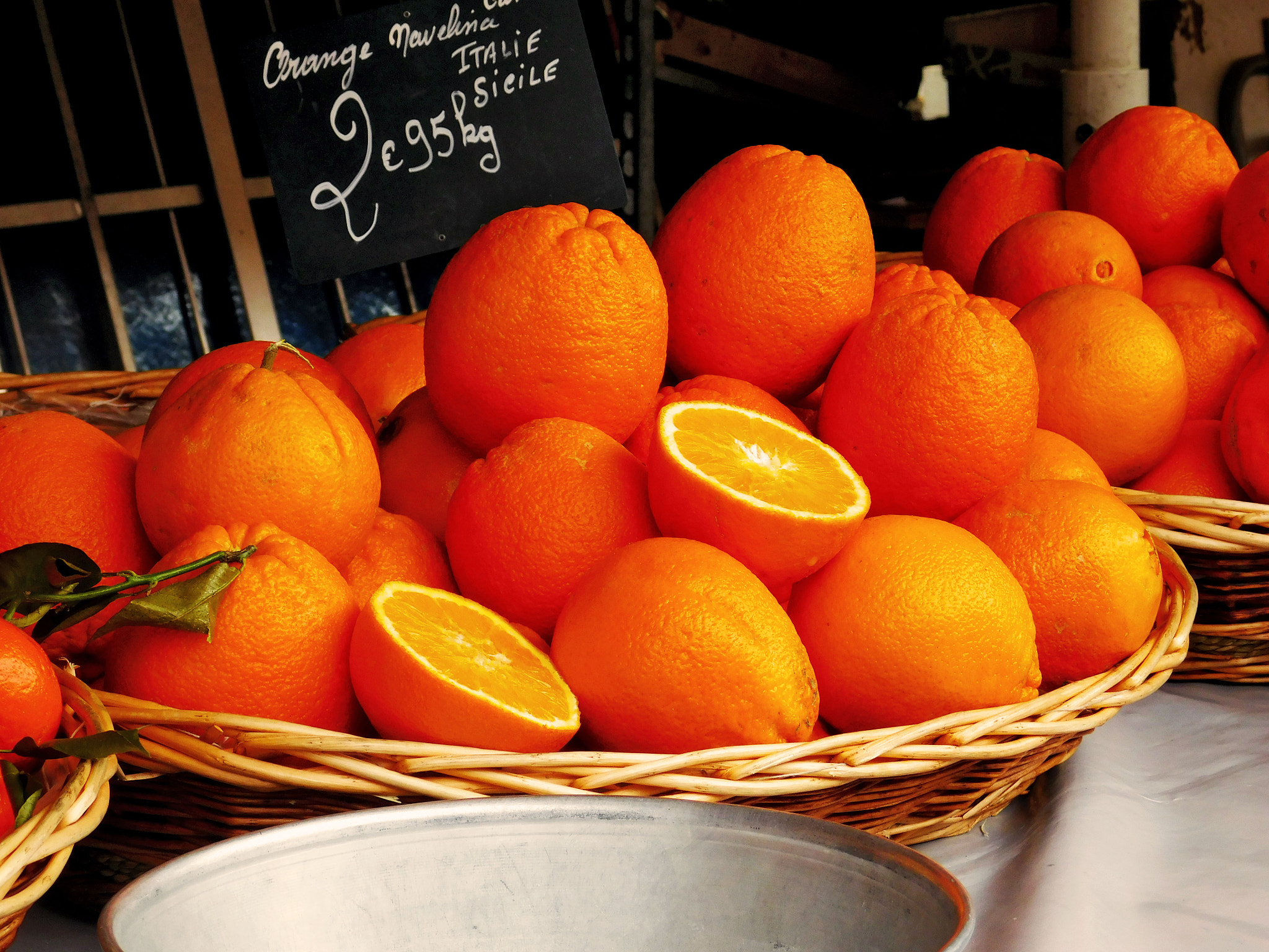 A basket of oranges at the market