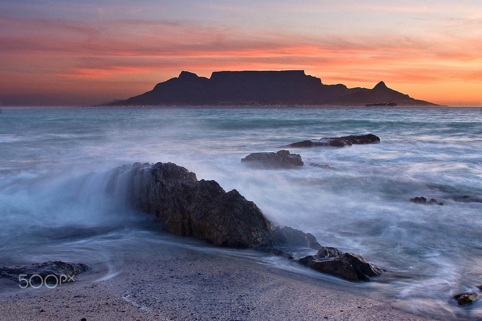 Canon EOS 40D + Canon EF-S 18-55mm F3.5-5.6 sample photo. The colors of table mountain at sunset with large rocks photography