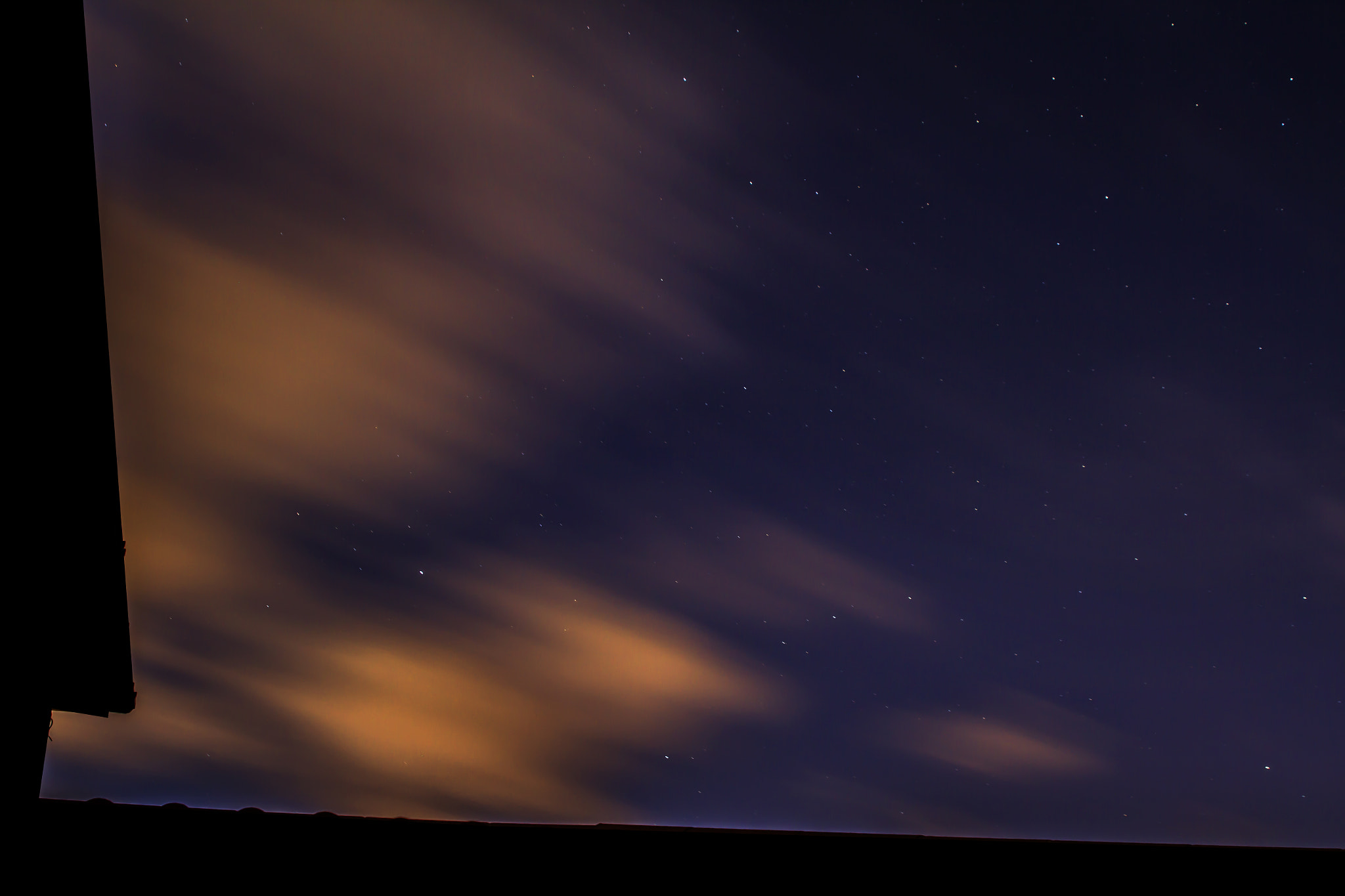 Canon EF 28-105mm f/3.5-4.5 USM sample photo. Stars, clouds and rooftops photography
