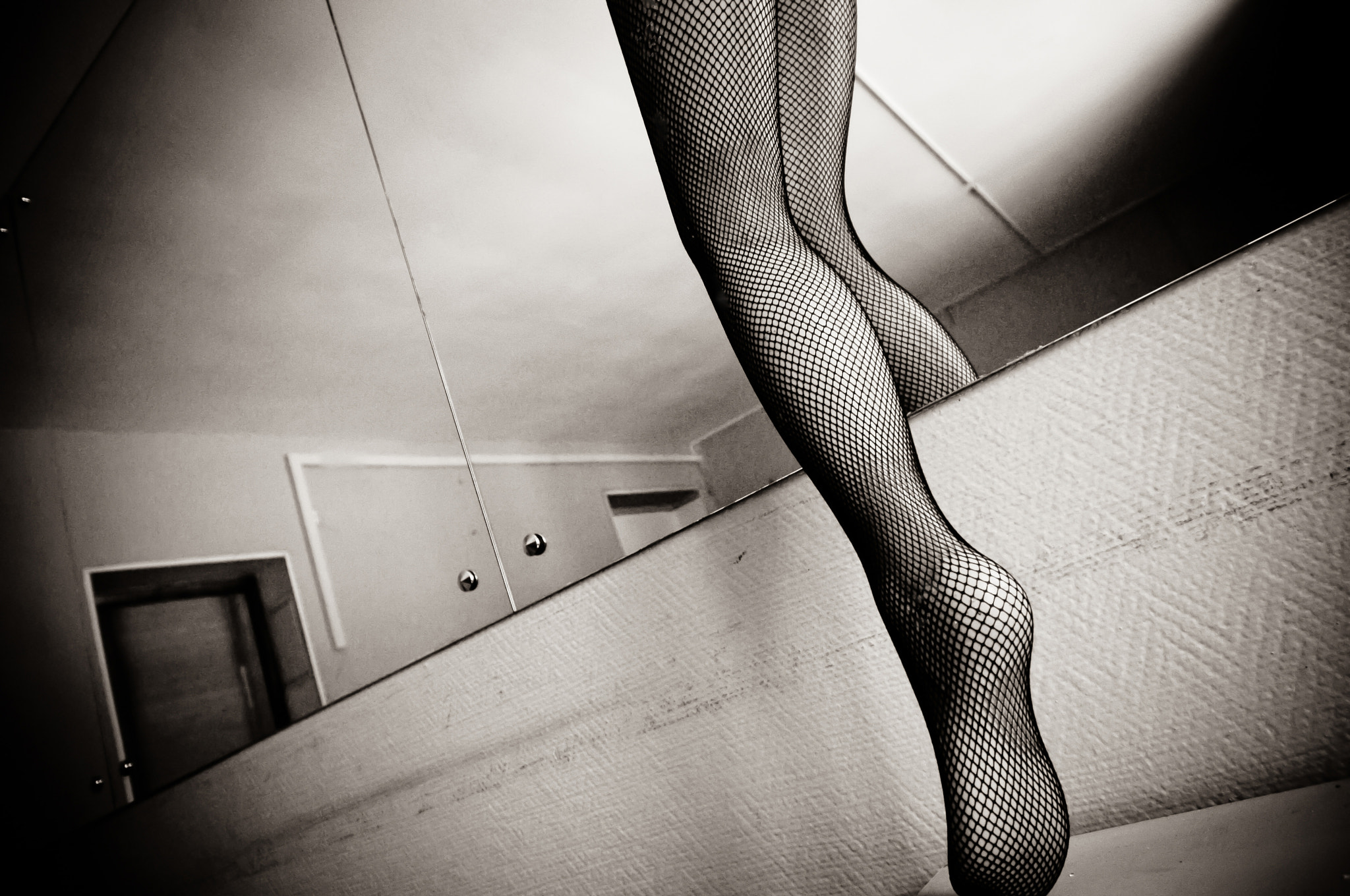 Sigma 10-20mm F3.5 EX DC HSM sample photo. Leg in the stocking, stepping into the mirror (sepia) photography