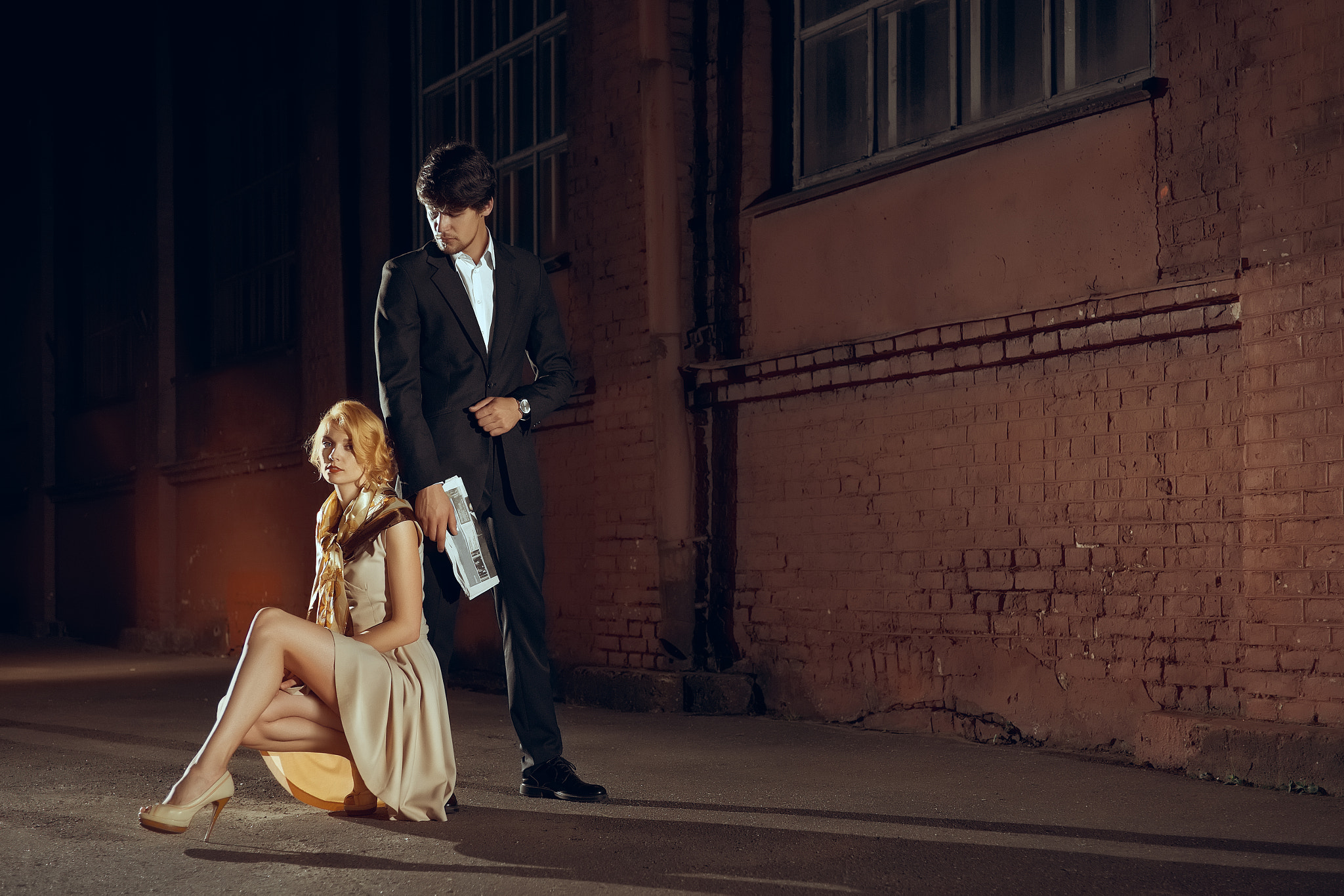 ZEISS Touit 32mm F1.8 sample photo. Attractive lady in dress and man in suit on the evening street photography