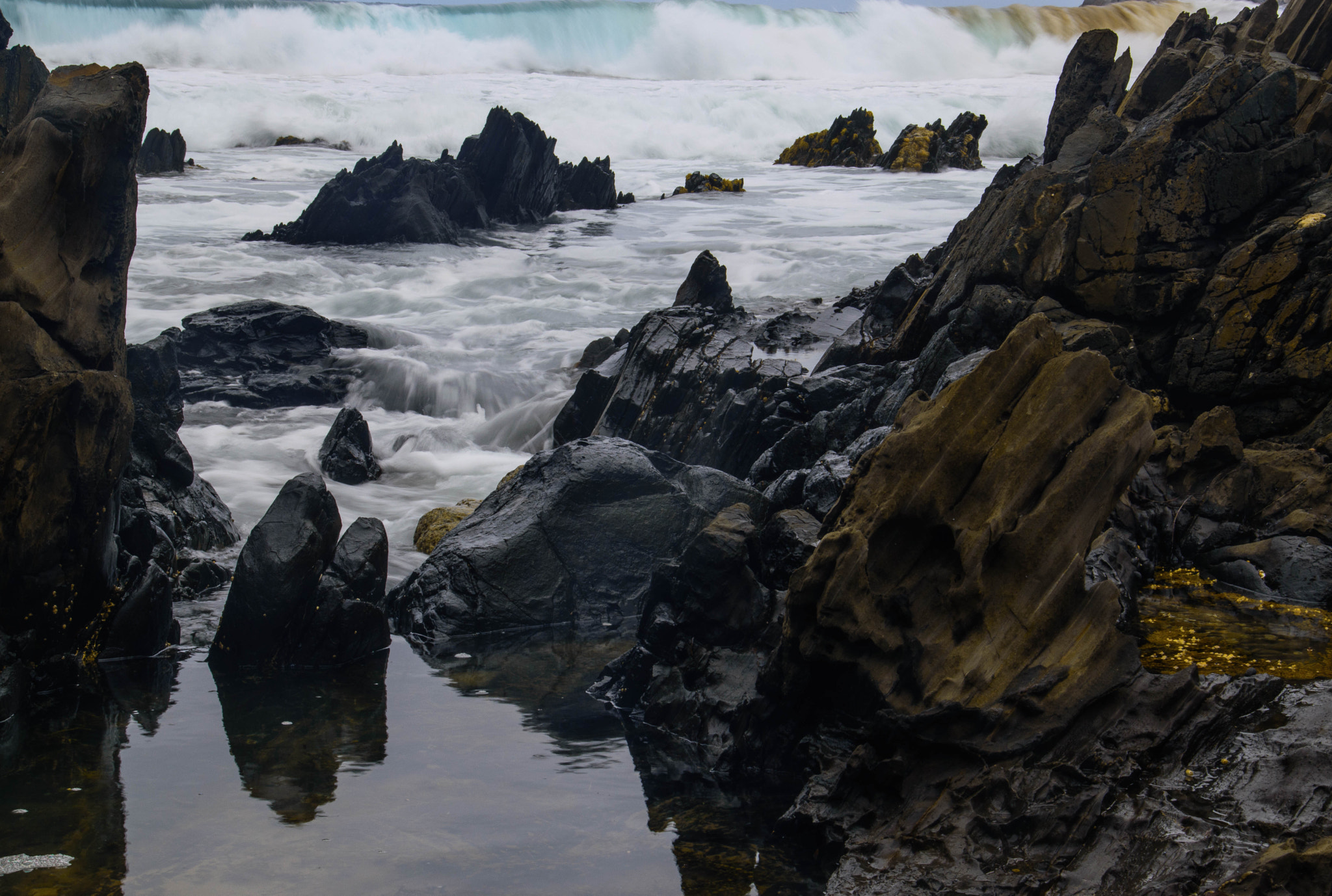 Sigma 18-250mm F3.5-6.3 DC Macro OS HSM sample photo. Peaceful reflections - dangerous rocks photography