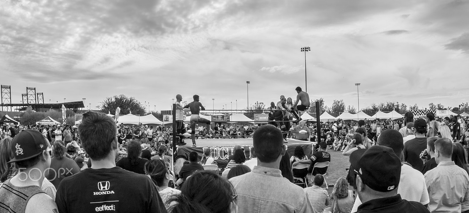 Canon EOS 1100D (EOS Rebel T3 / EOS Kiss X50) + Sigma 15mm f/2.8 EX Fisheye sample photo. Arizona taco festival luchador match photography