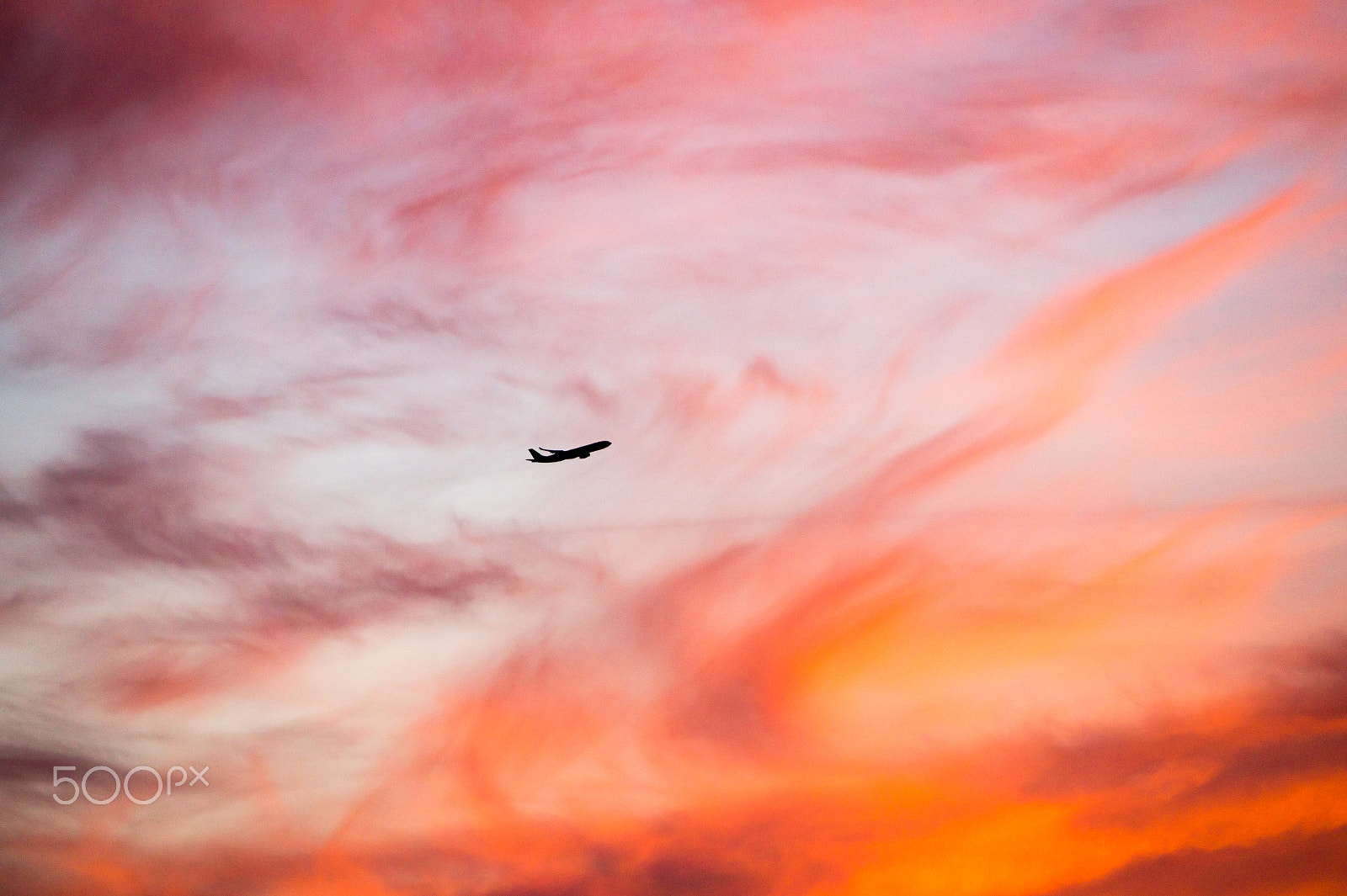 Sony Alpha a5000 (ILCE 5000) + Sony E 18-200mm F3.5-6.3 OSS sample photo. Airliner flying into the sunset photography