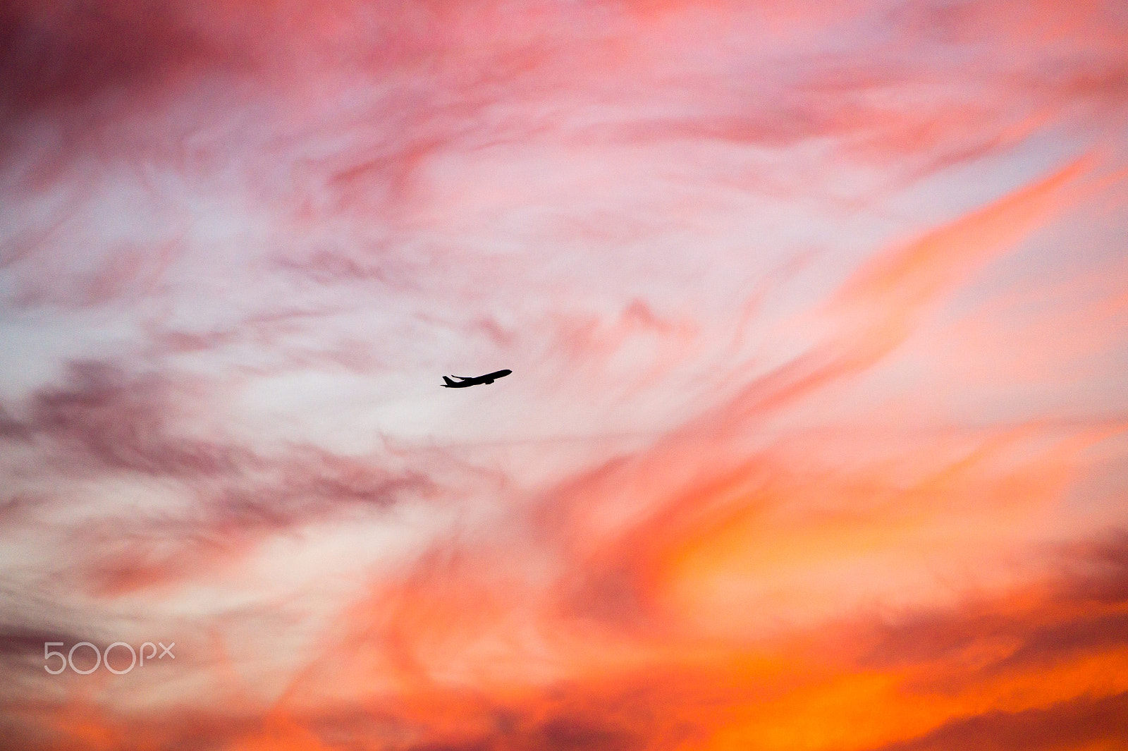 Sony E 18-200mm F3.5-6.3 OSS sample photo. Airliner flying into the sunset photography