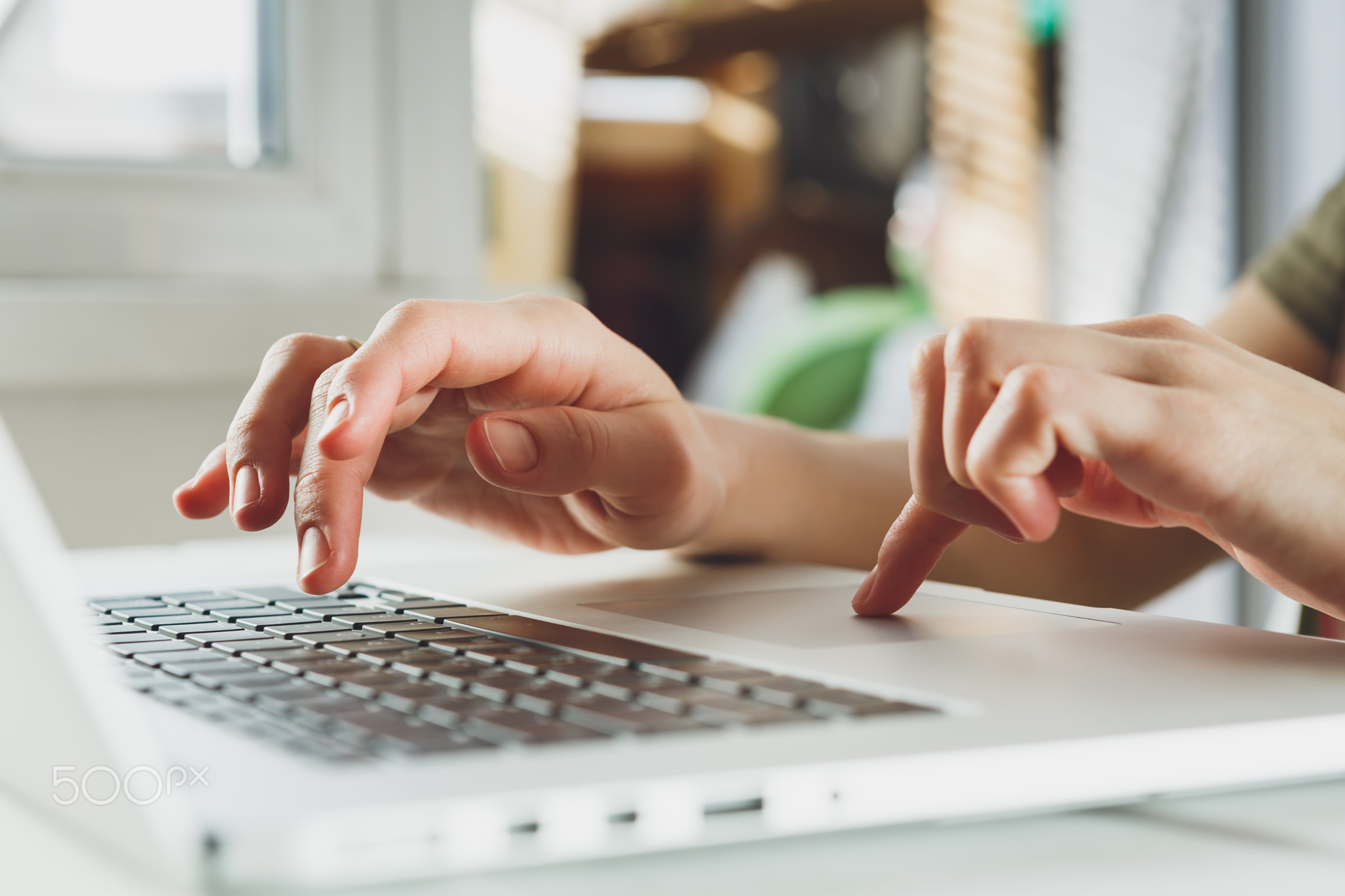 woman's hands working on laptop computer