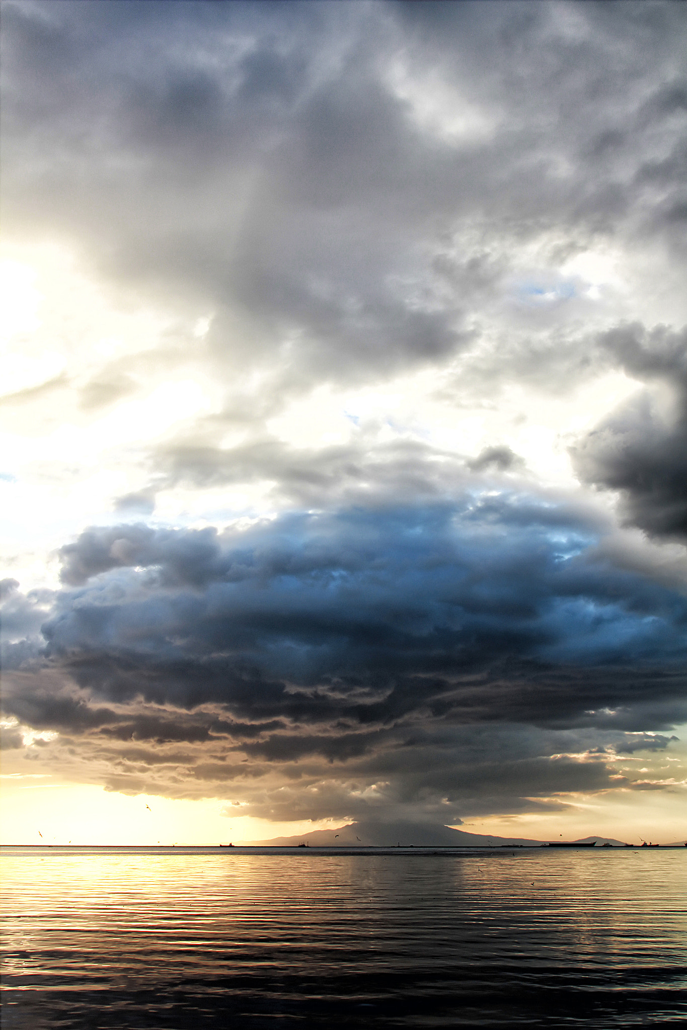 Canon EF 22-55mm f/4-5.6 USM sample photo. Philippines manila bay clouds volcano photography