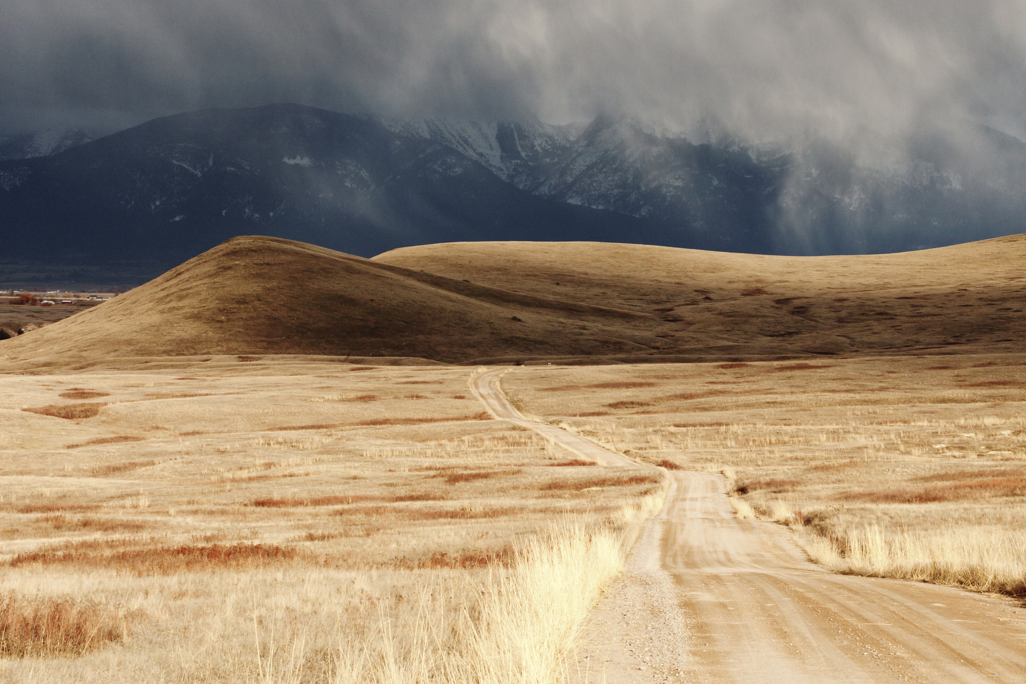 Canon EOS-1D Mark III sample photo. Storm cloud passing through a barren mountain landscape photography