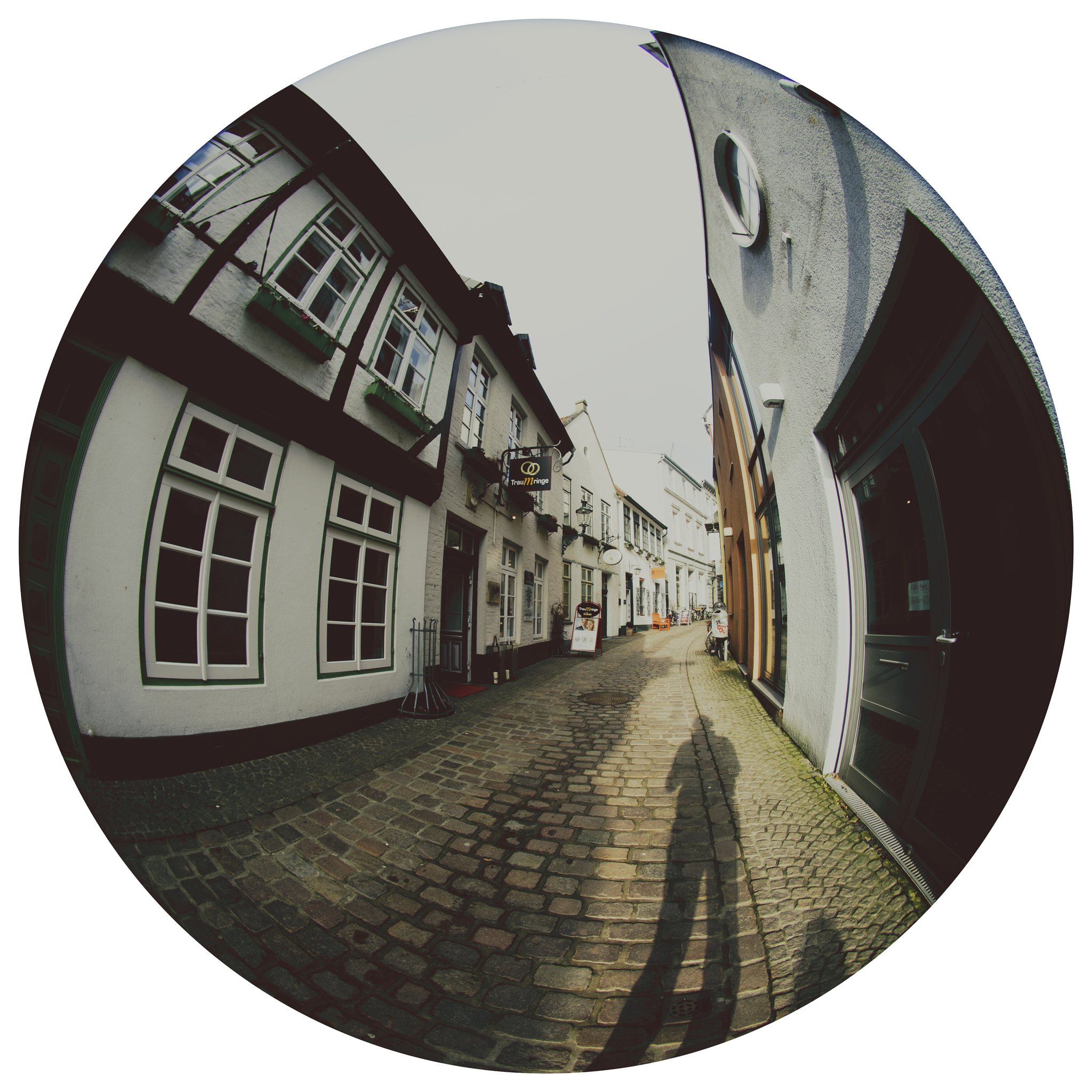 Sony a7 + Sigma 8mm F3.5 EX DG Circular Fisheye sample photo. Winding cobble street photography