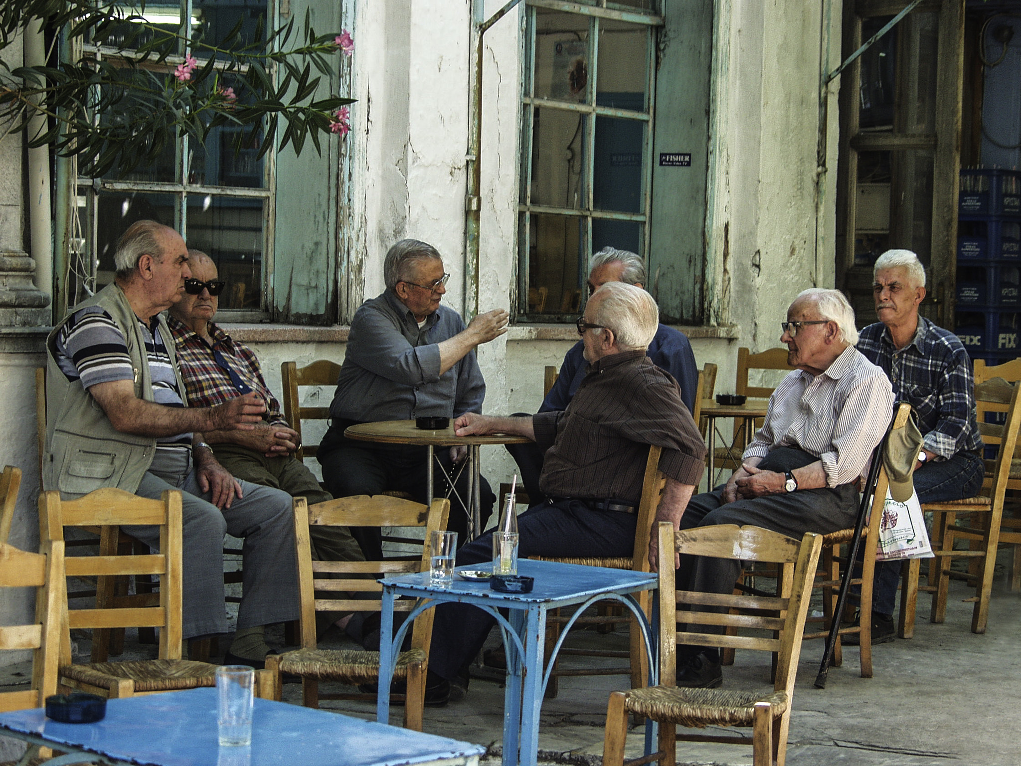 Olympus E-10 sample photo. Cafe chatting in mitilini photography