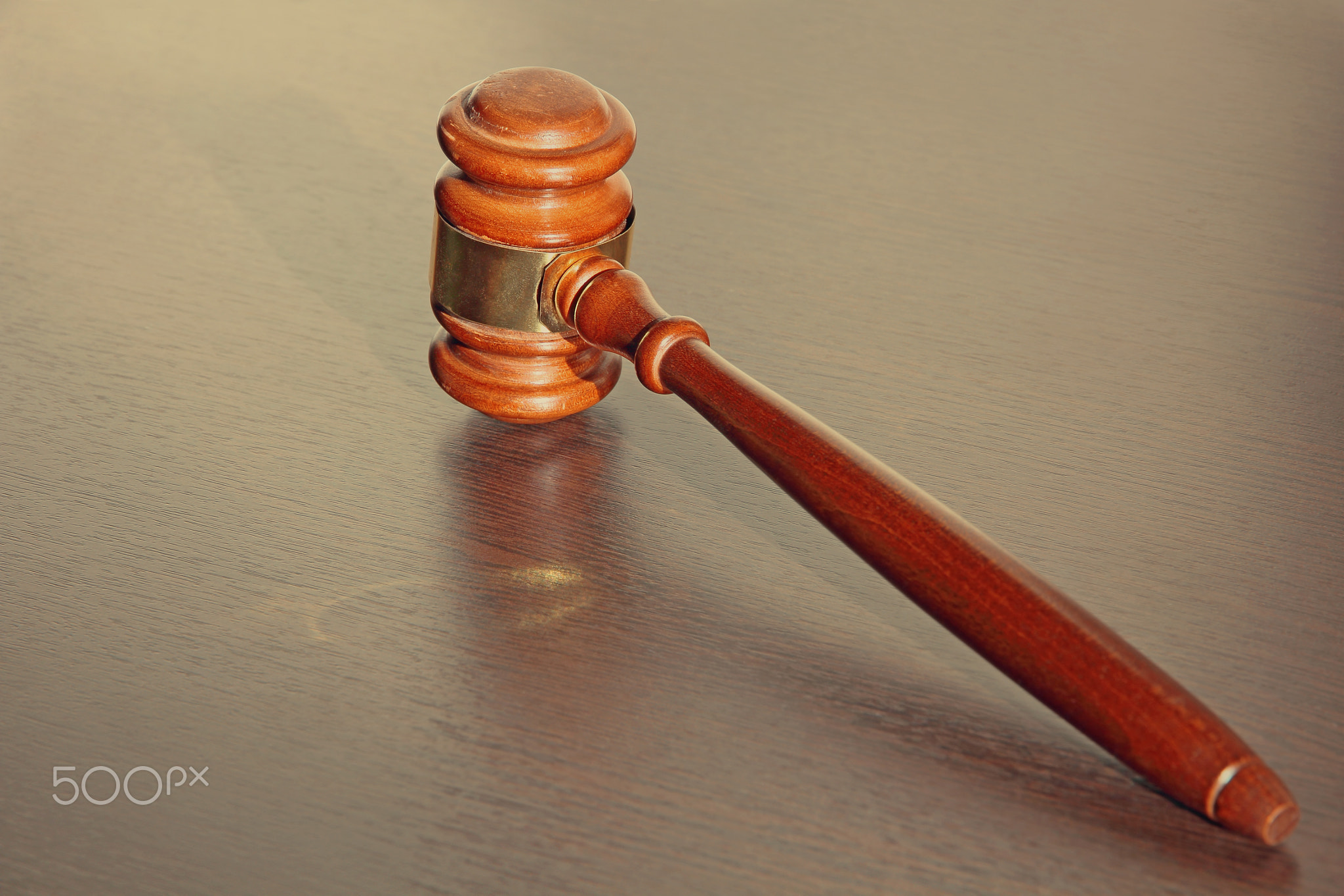 Judge gavel on wooden table.