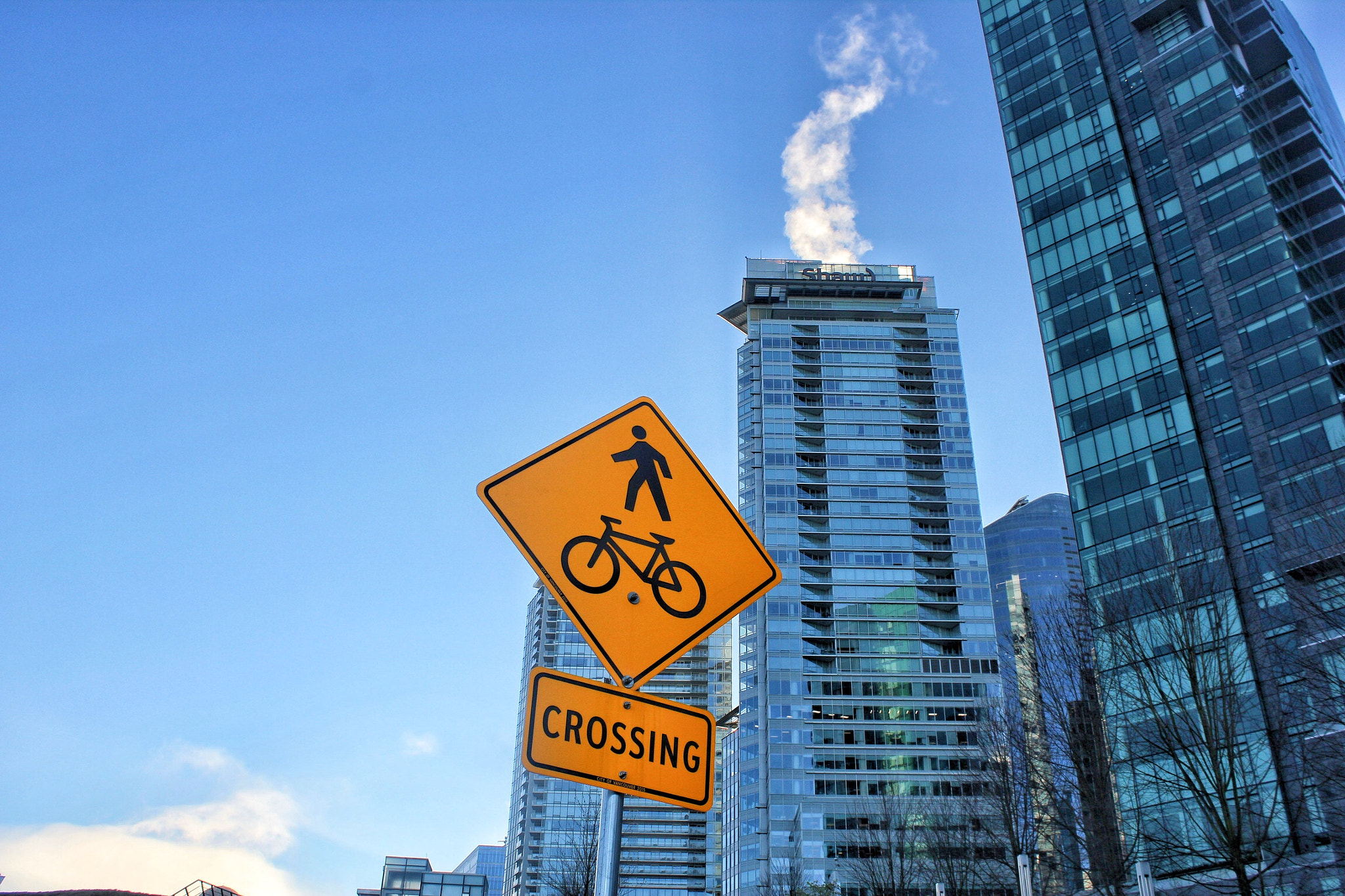 Canon EOS 550D (EOS Rebel T2i / EOS Kiss X4) + Canon EF-S 18-55mm F3.5-5.6 IS sample photo. Crossing sign by coal harbor- vancouver photography