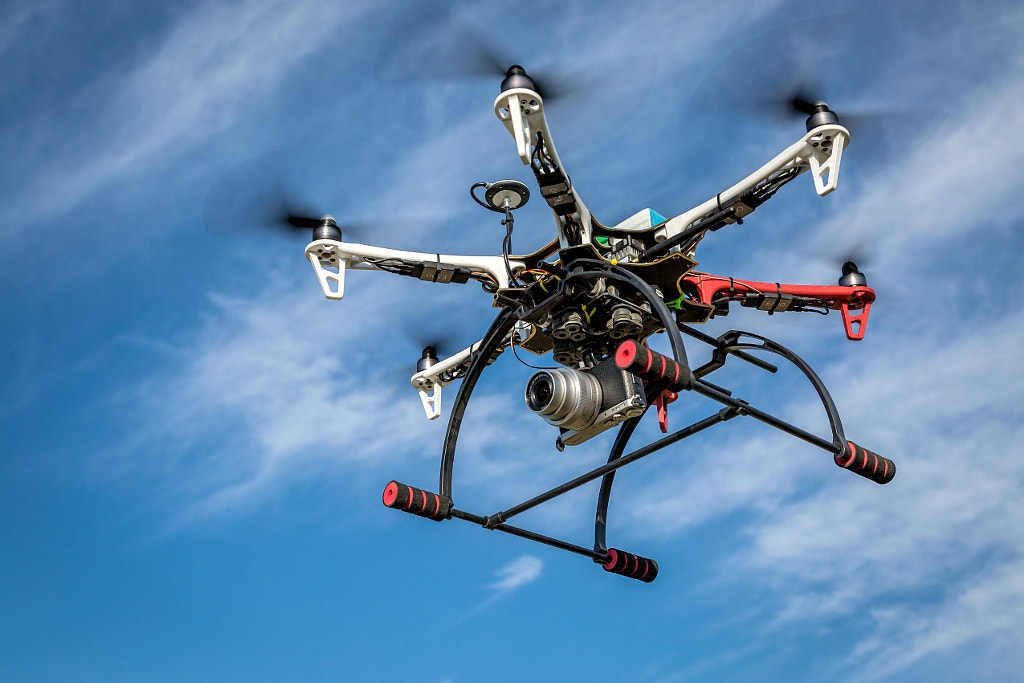 airborne hexacopter drone carrying camera by Marek Uliasz on 500px.com