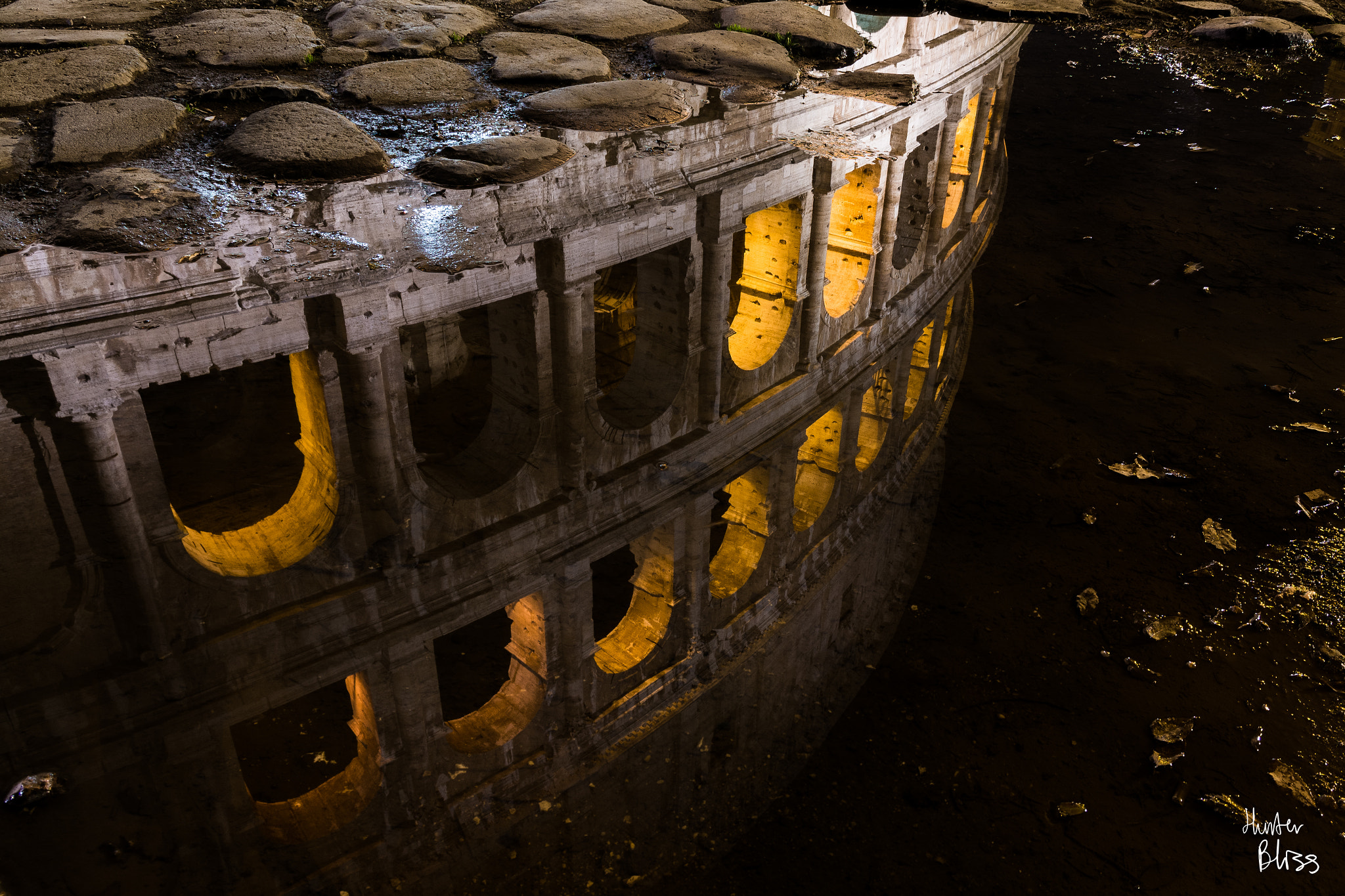 Sigma 17-70mm F2.8-4 DC Macro OS HSM | C sample photo. Colosseum in a puddle photography