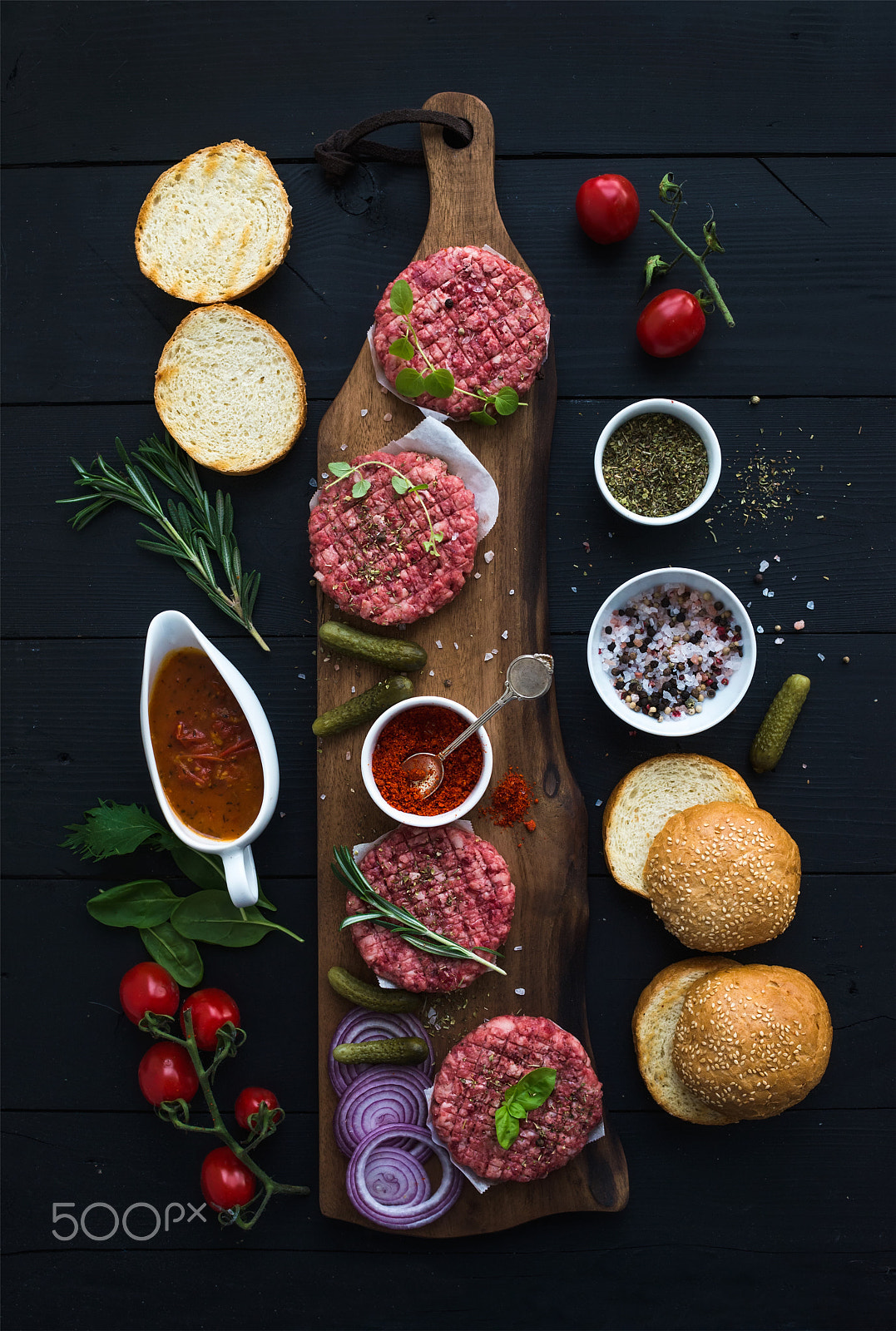 Nikon D610 + ZEISS Distagon T* 35mm F2 sample photo. Ingredients for cooking burgers. raw ground beef meat cutlets on wooden board, red onion, cherry... photography
