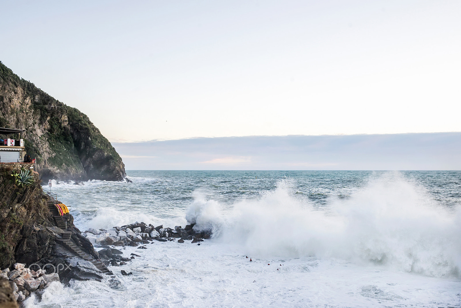 Nikon D610 + ZEISS Distagon T* 35mm F2 sample photo. Big wave breaking over cliff at riomaggiore, liguria during a stormy winter day. photography