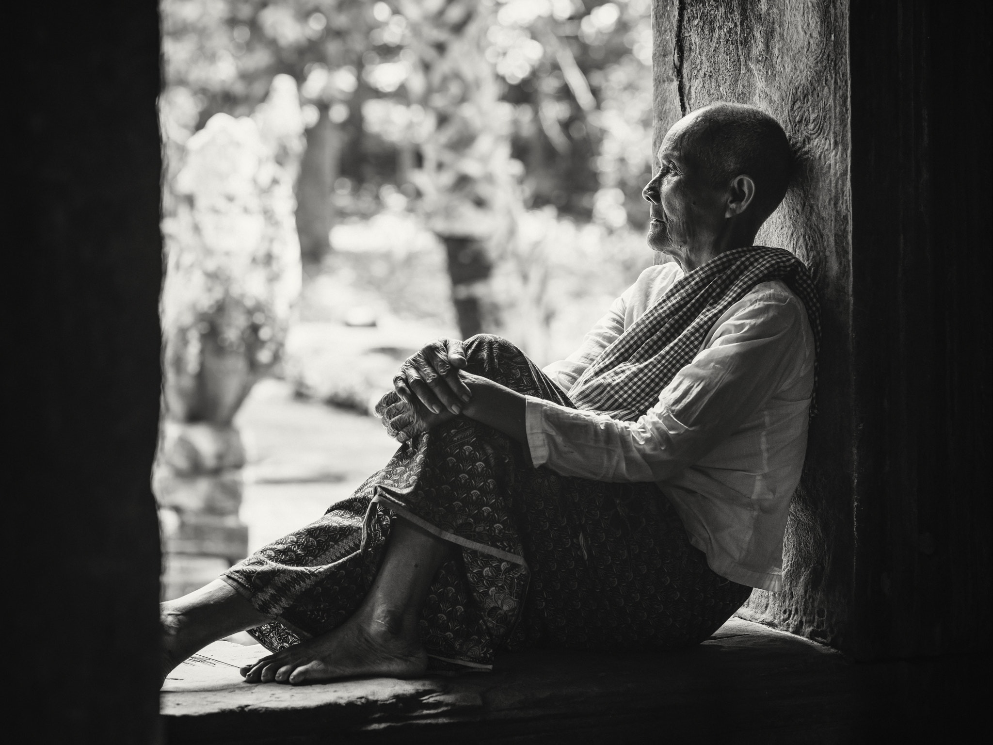 Sony a7R sample photo. Buddhist nun in a moment of reflection photography