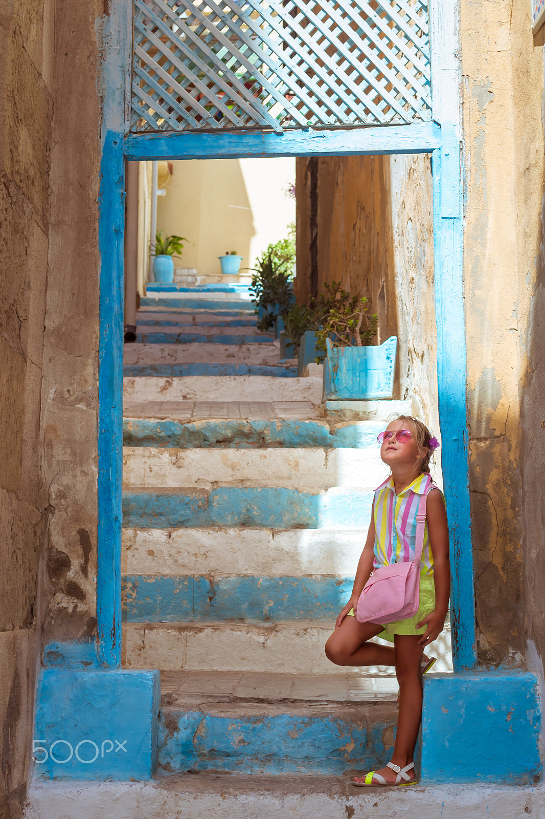 Nikon D3100 + Sigma 50mm F1.4 EX DG HSM sample photo. Girl in pink glasses standing on stairs, alicante, valencia, spa photography