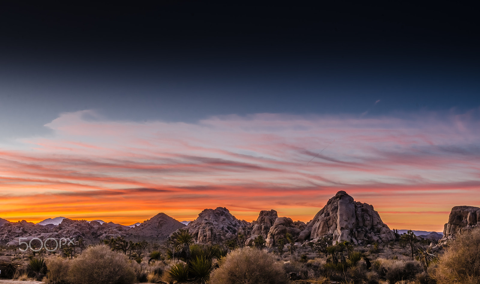 Nikon AF-S Nikkor 17-35mm F2.8D ED-IF sample photo. Sunset view of desert with wispy clouds photography
