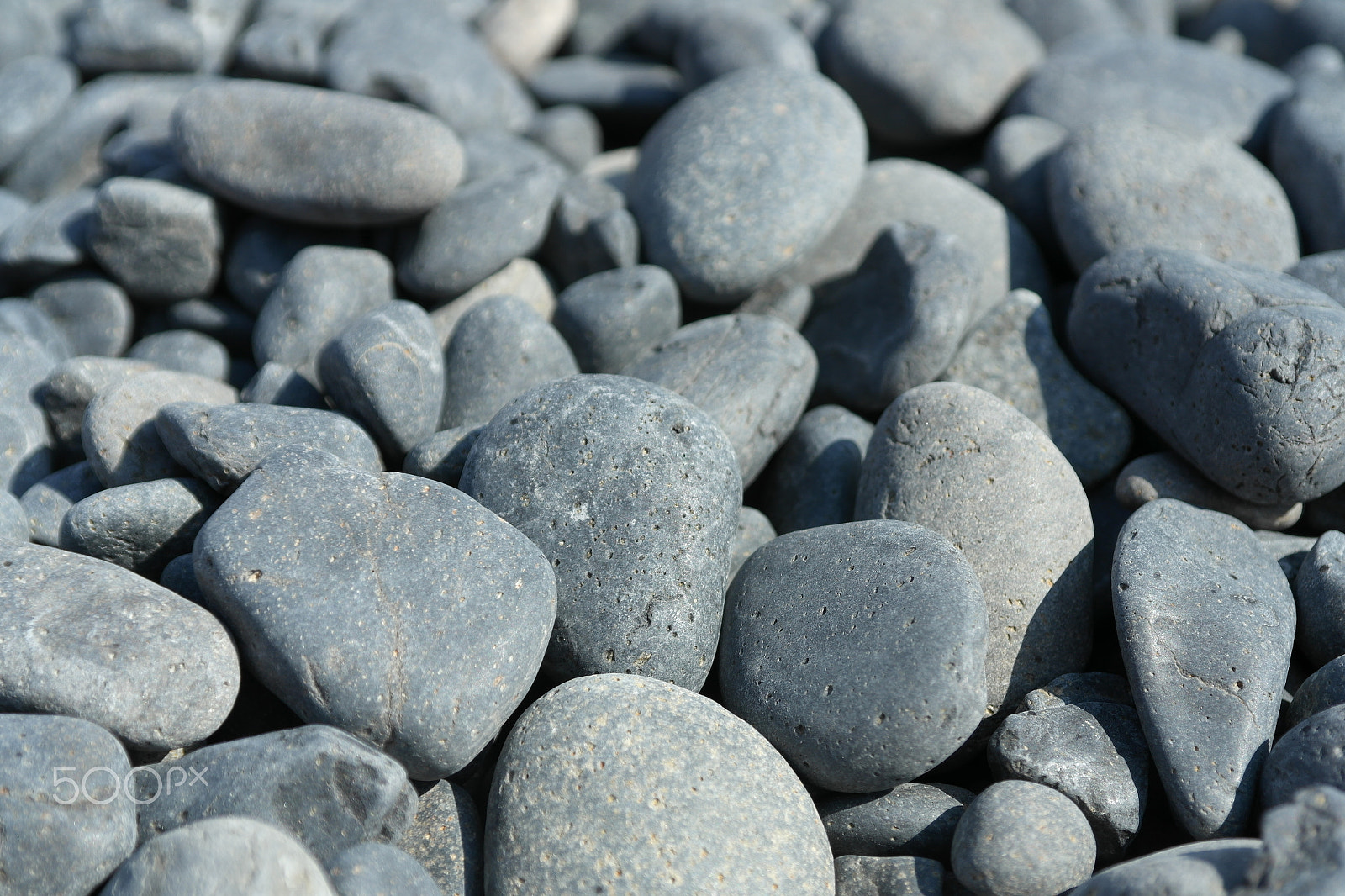 Samsung NX210 sample photo. Black rocks on beach in greece photography