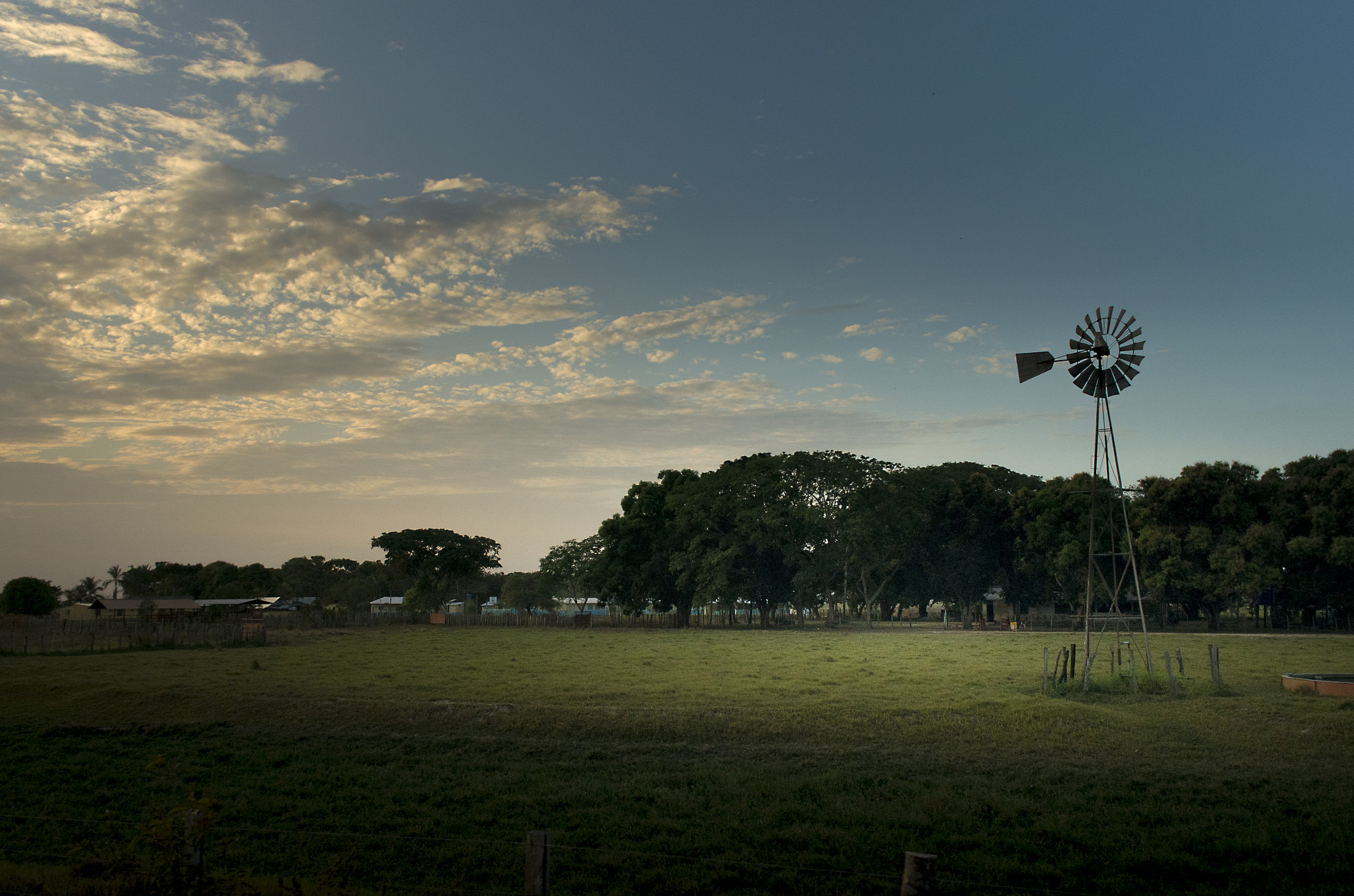 Pentax K-5 IIs + Pentax smc DA 21mm F3.2 AL Limited sample photo. A farm under sunset photography