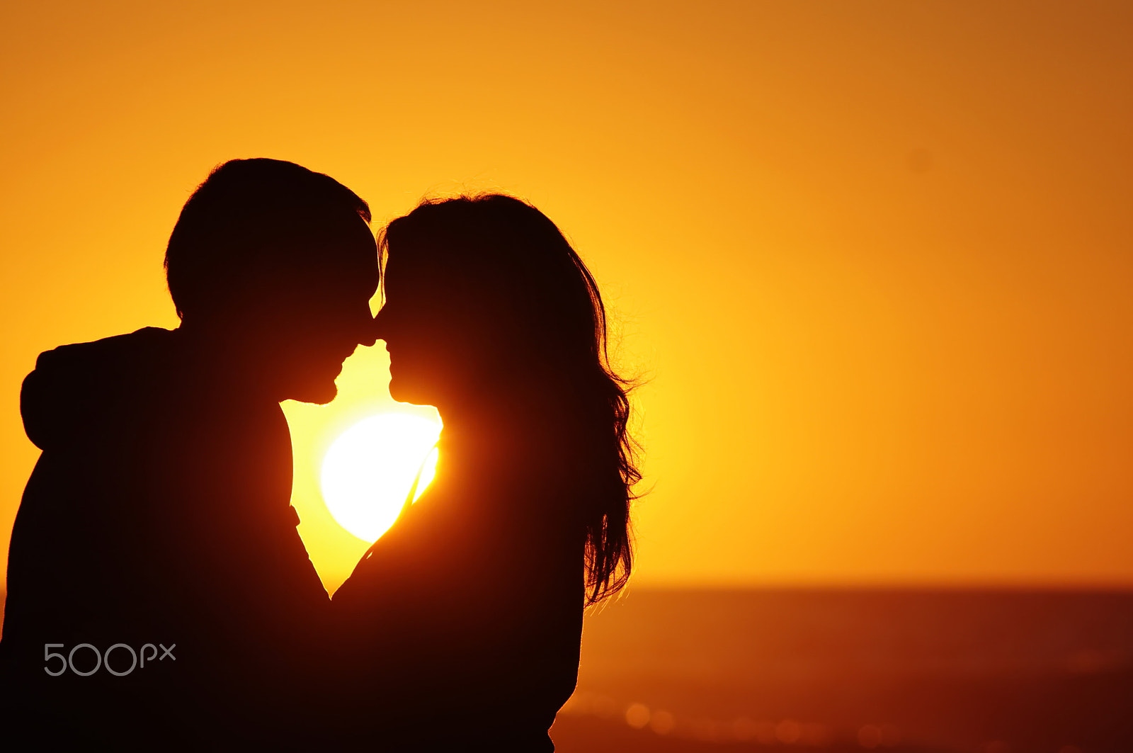 Pentax smc DA 55-300mm F4.0-5.8 ED sample photo. Loving couple beach sunset photography