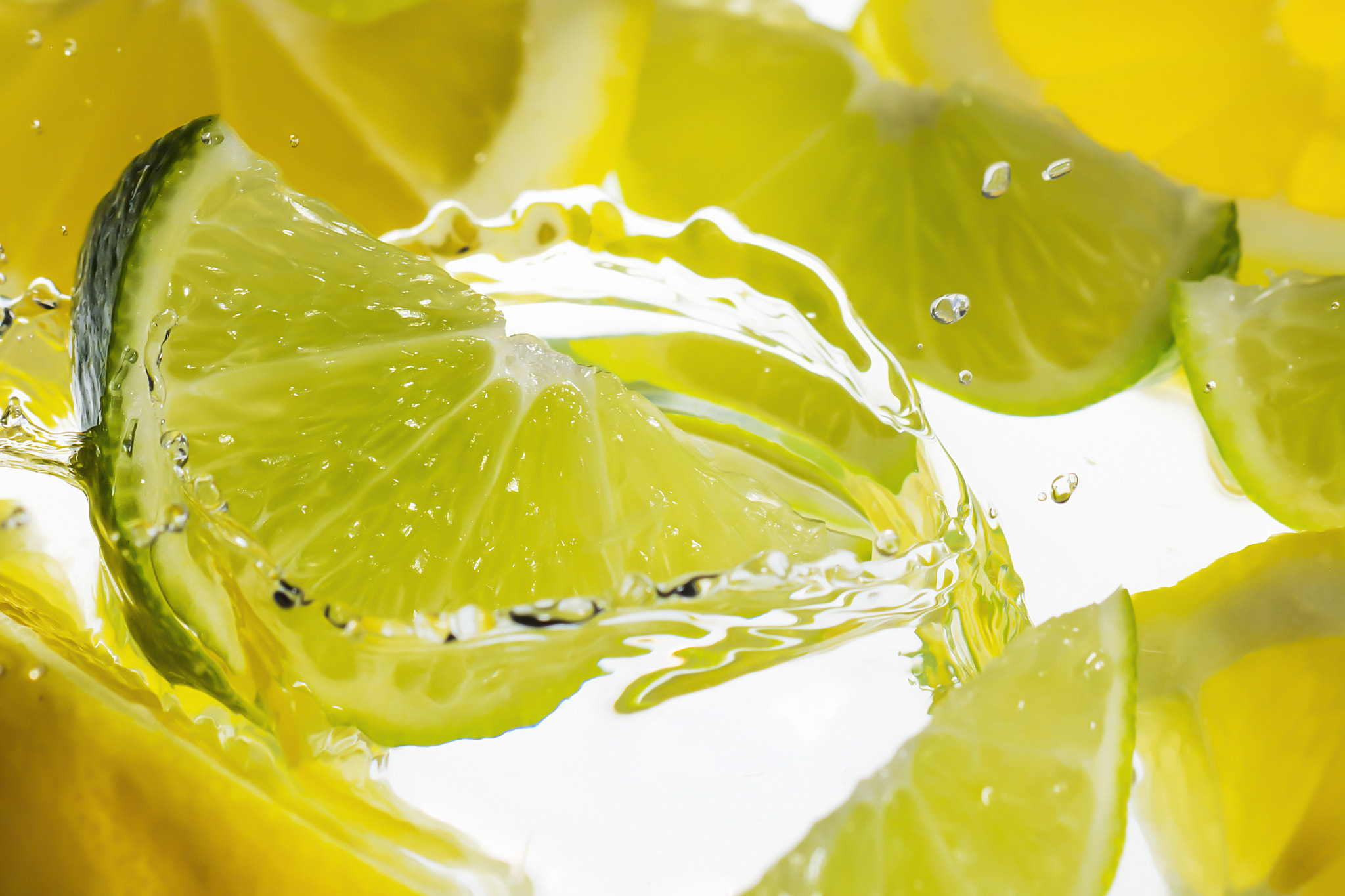 Nikon PC-E Micro-Nikkor 85mm F2.8D Tilt-Shift sample photo. Water splash with yellow lemon and green lime. photography