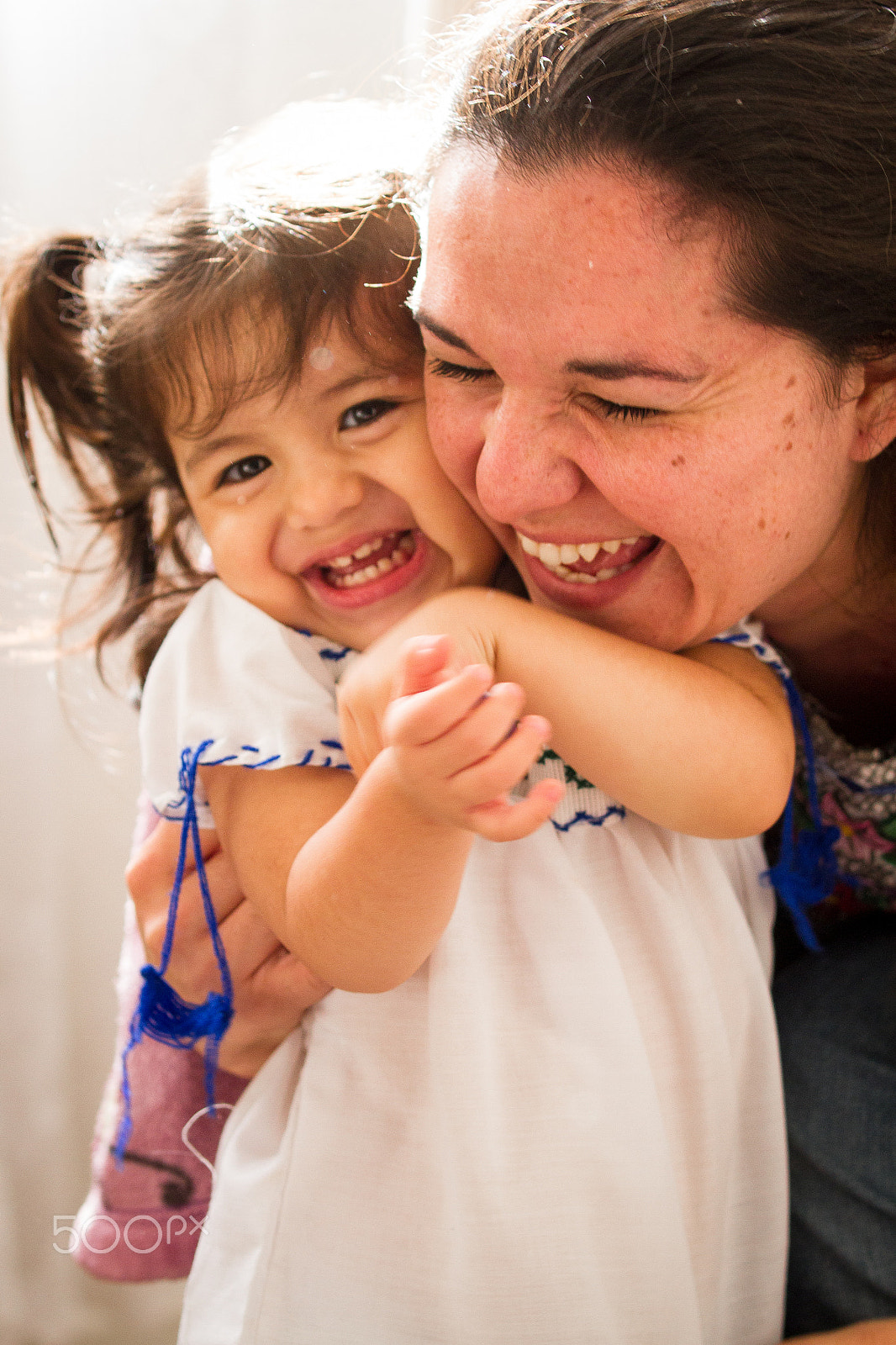 Tamron SP AF 70-200mm F2.8 Di LD (IF) MACRO sample photo. A hispanic mother hugging her small child and smiling photography