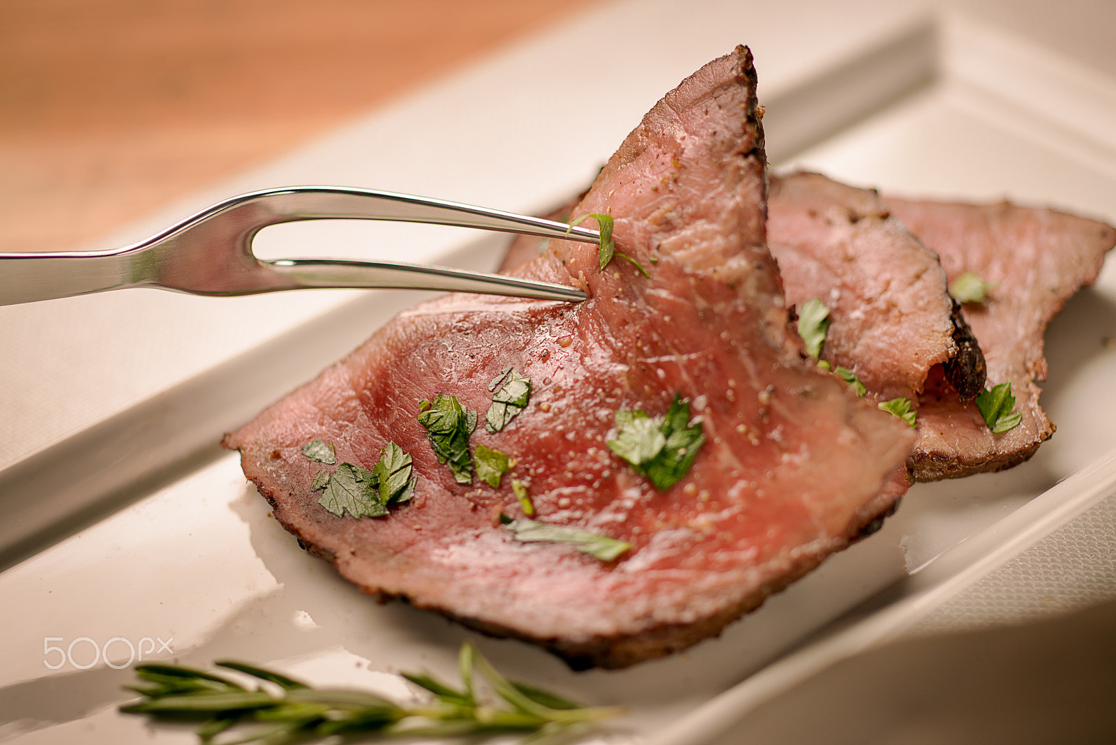 Nikon PC-E Micro-Nikkor 85mm F2.8D Tilt-Shift sample photo. A slice of roast beef being picked up by a dinner fork photography