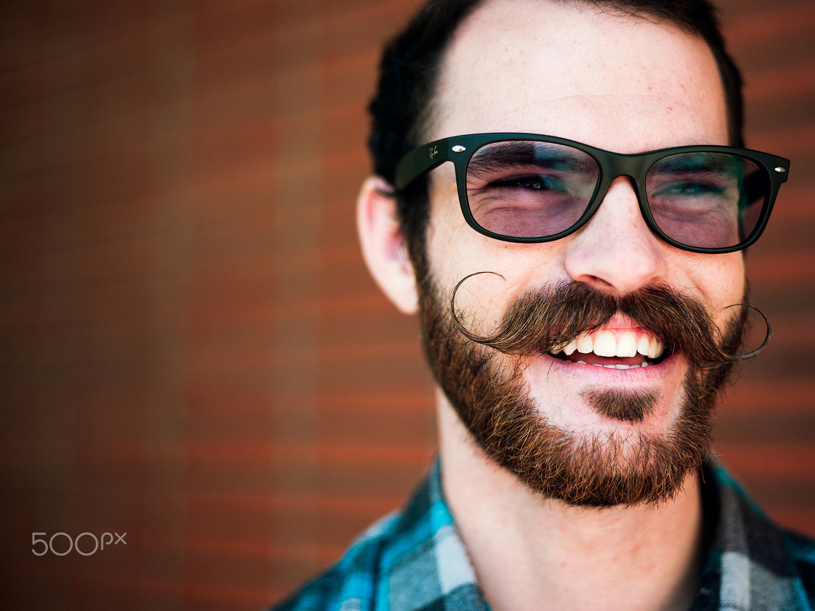 Phase One P25+ sample photo. A young man with a large curled mustaches smiling photography