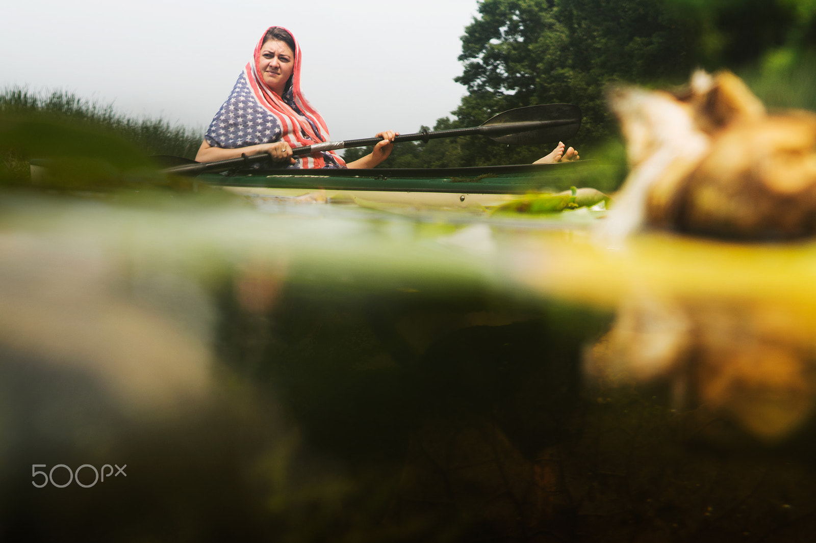 Sony a7R + E 50mm F1.8 OSS sample photo. A young woman kayaking down a stream photography