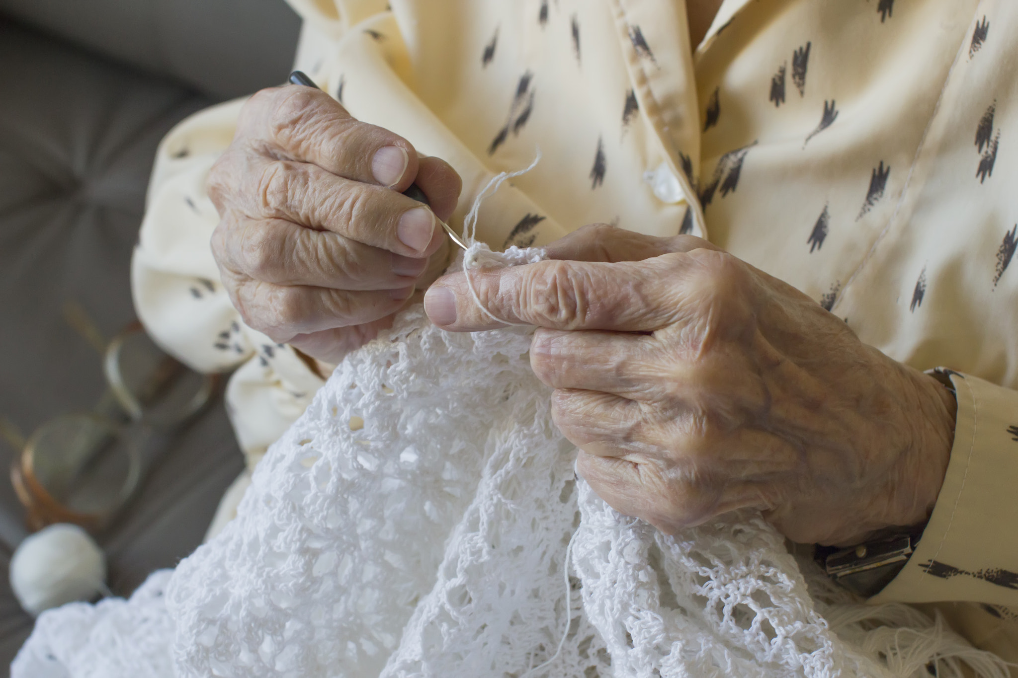 Detail of the hands crocheting