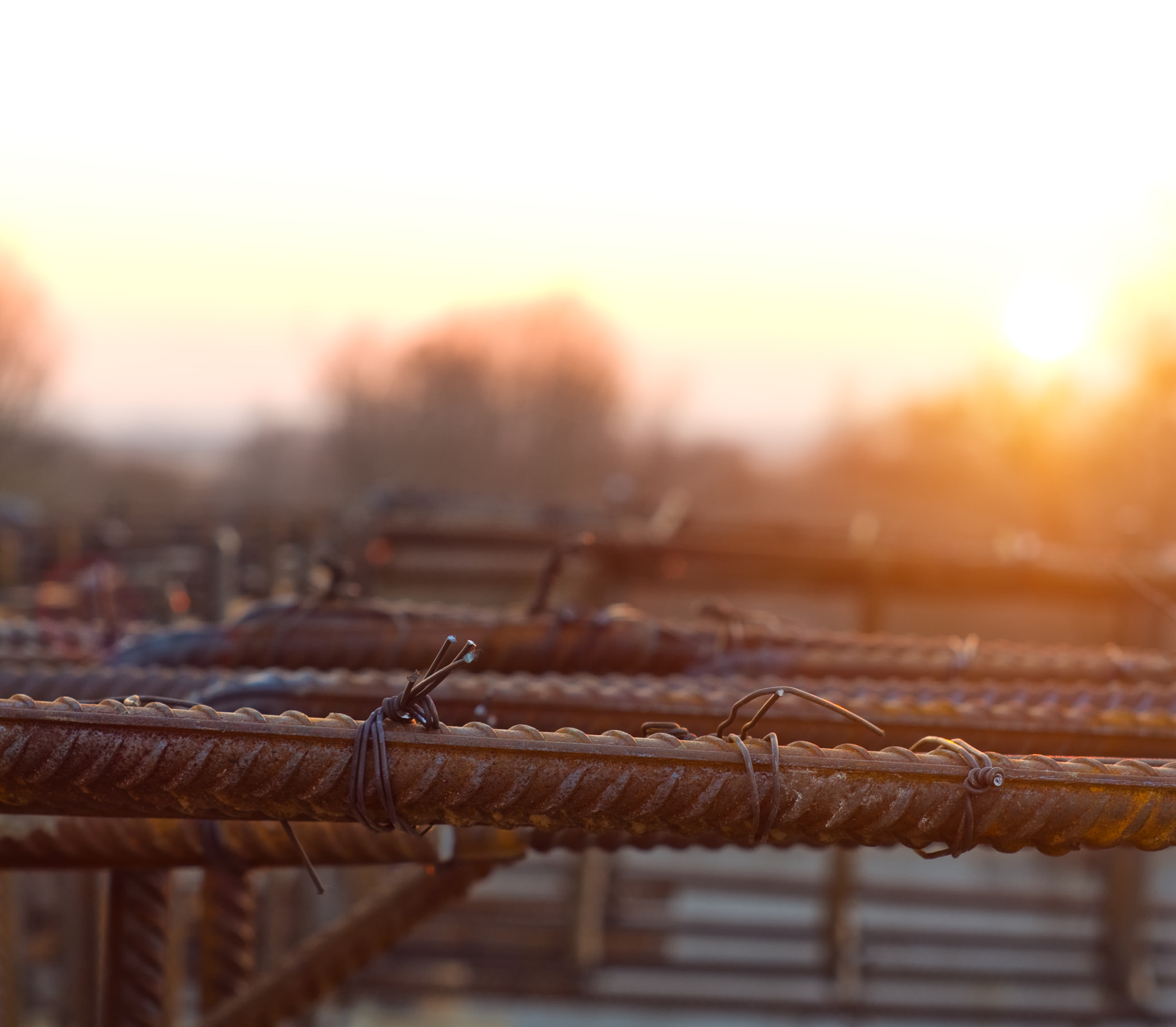 Pentax K-x + A Series Lens sample photo. Armature is tied under the concrete foundation at sunset photography