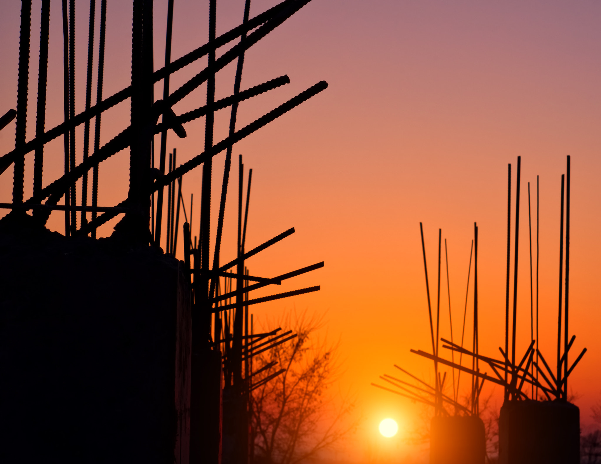 Pentax K-x + A Series Lens sample photo. Armature from concrete columns at sunset photography