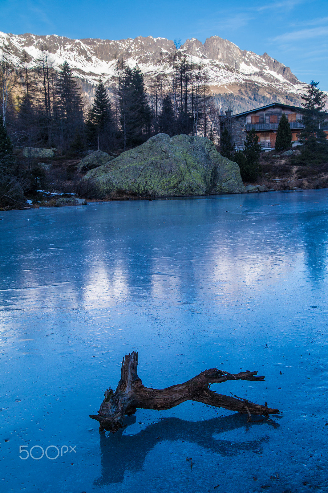 Sony SLT-A58 + Tamron 18-270mm F3.5-6.3 Di II PZD sample photo. Frozen lake with dead wood in the french alps photography