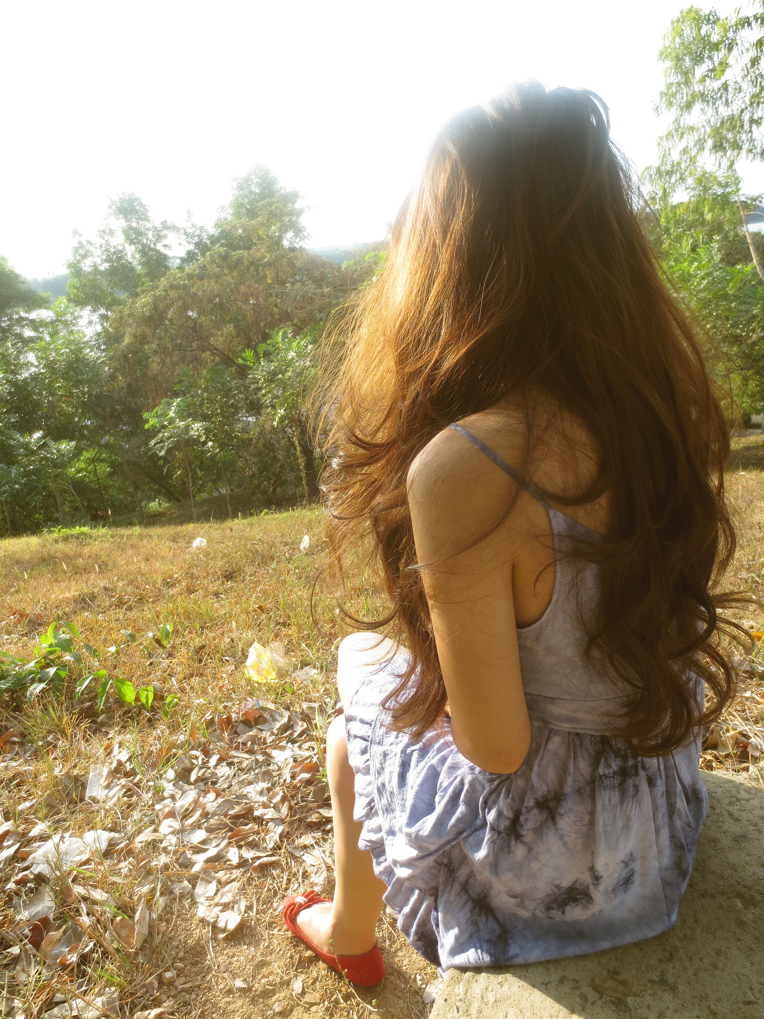 Canon PowerShot ELPH 110HS (PowerShot IXUS 125 HS) sample photo. Girl sitting in the afternoon sun photography
