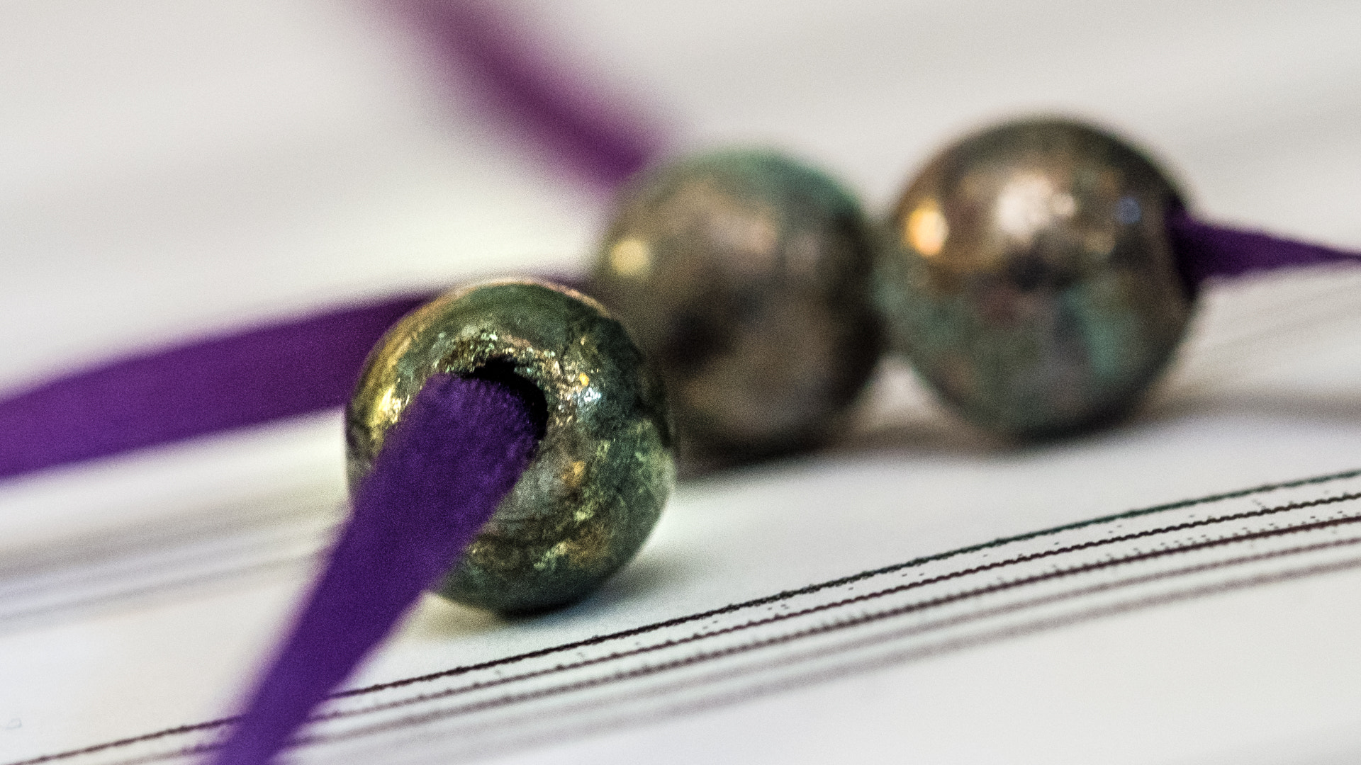 Fujifilm X-E1 + Fujifilm XF 60mm F2.4 R Macro sample photo. Beads on music paper photography